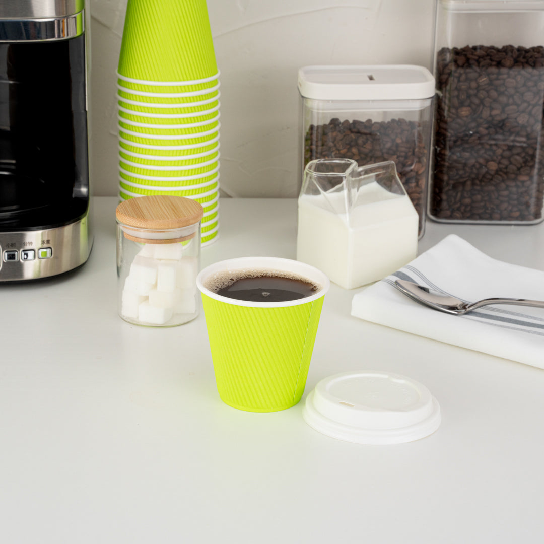 Eco-Friendly 8 oz Paper Ripple Wall Coffee Cups with White Lids - 3.5