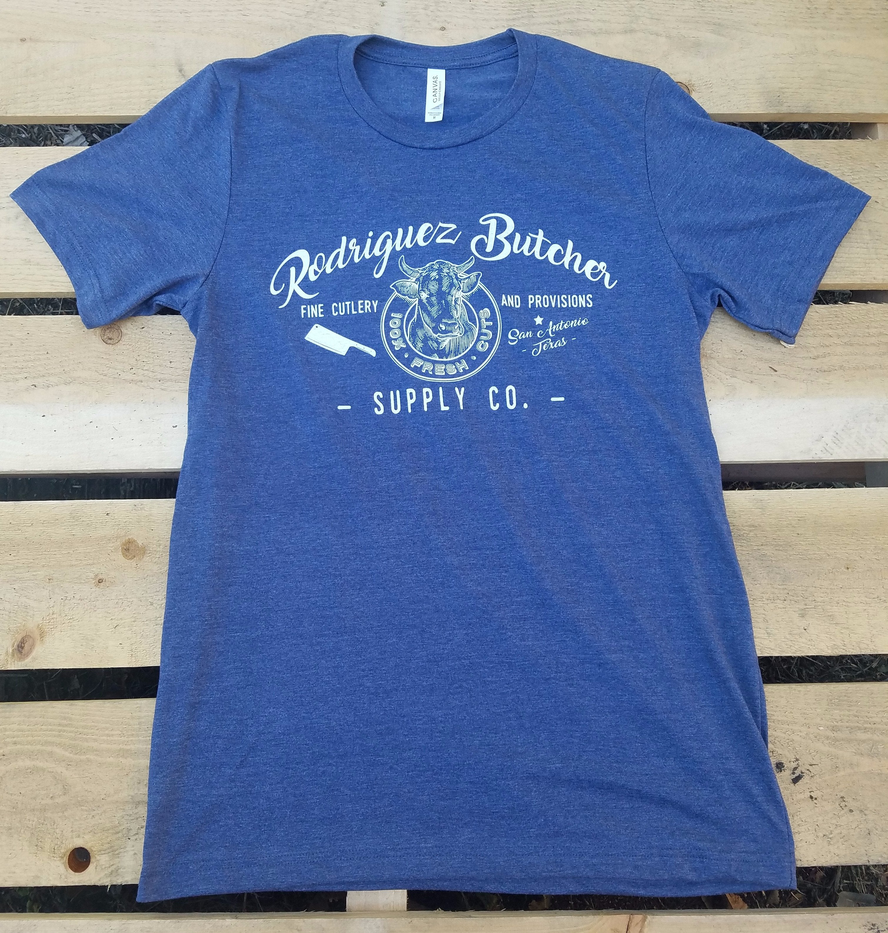 Rodriguez Butcher Supply T-Shirt - Heather Navy Color | Comfortable Workwear for Butchers & Meat Processing Professionals | Perfect for Kitchen, Deli & Food Service Jobs