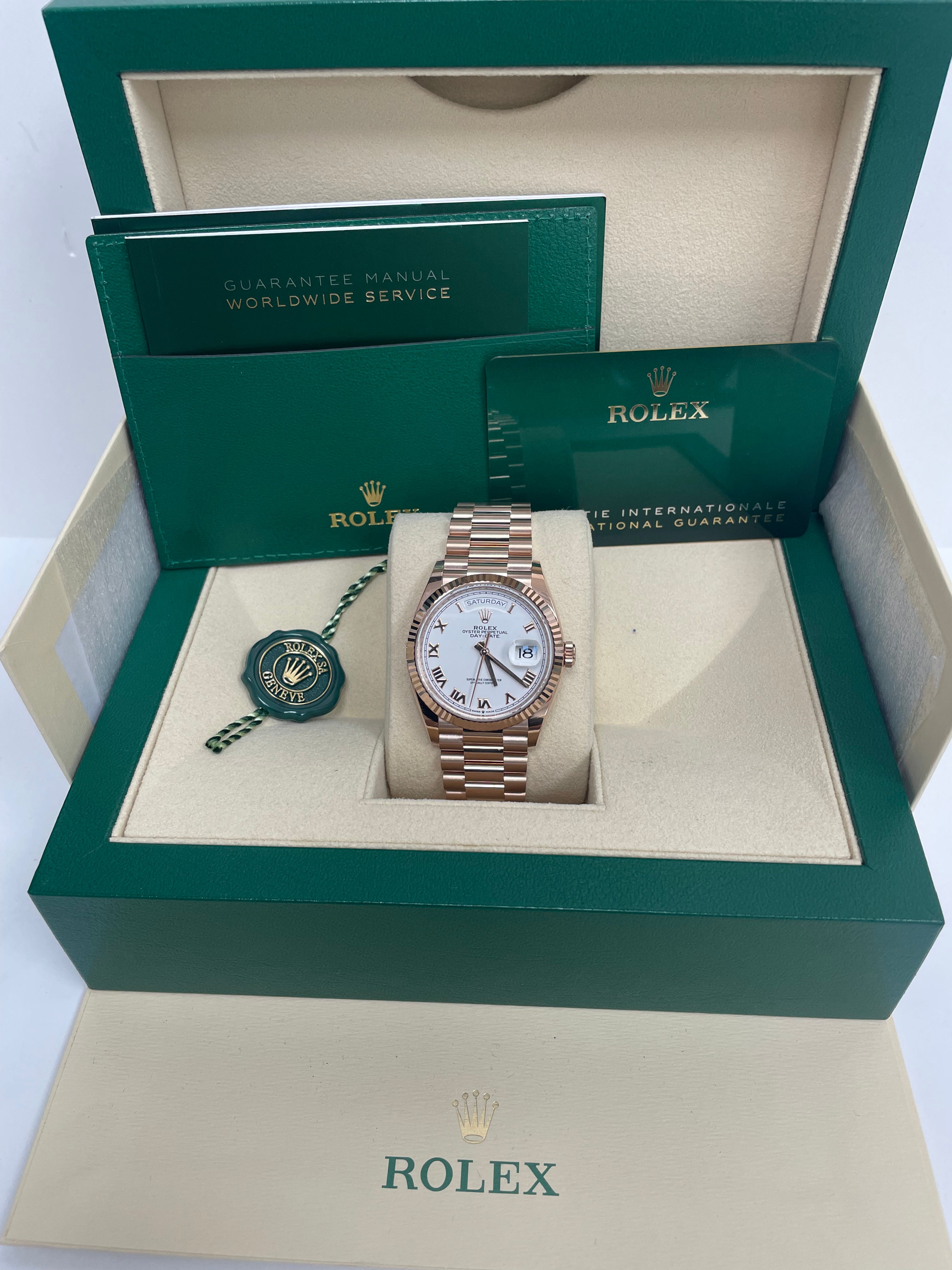 Rolex Everose Gold Day Date 36 Watch with Fluted Bezel & White Roman Dial - President Bracelet Ref# 128235 | Luxury Dress Watch for Business & Formal Occasions