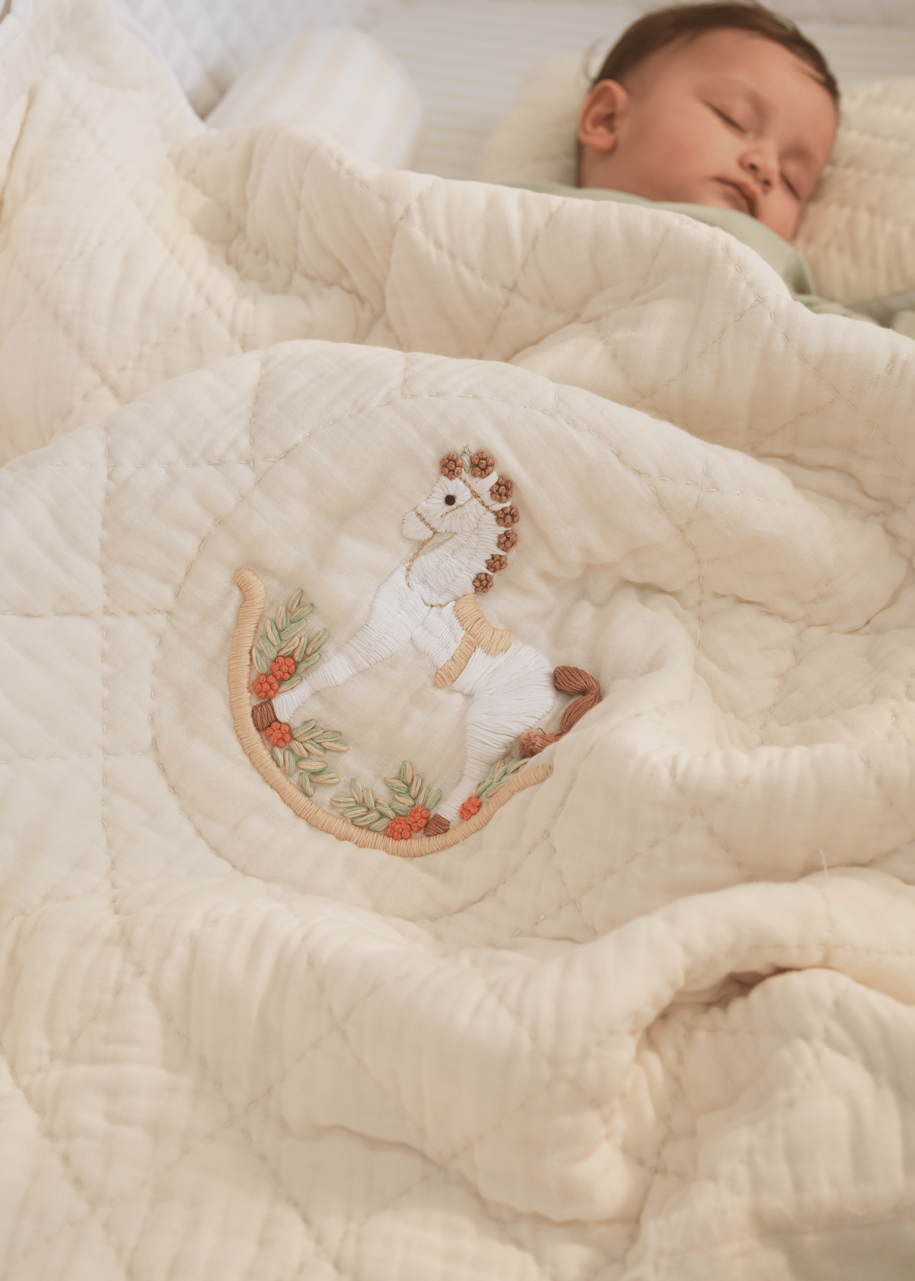 The Sleep Cloud Nest Ecru Baby Blanket with Rocking Horse Design - Soft & Cozy for Nursery, Swaddling, and Stroller Use