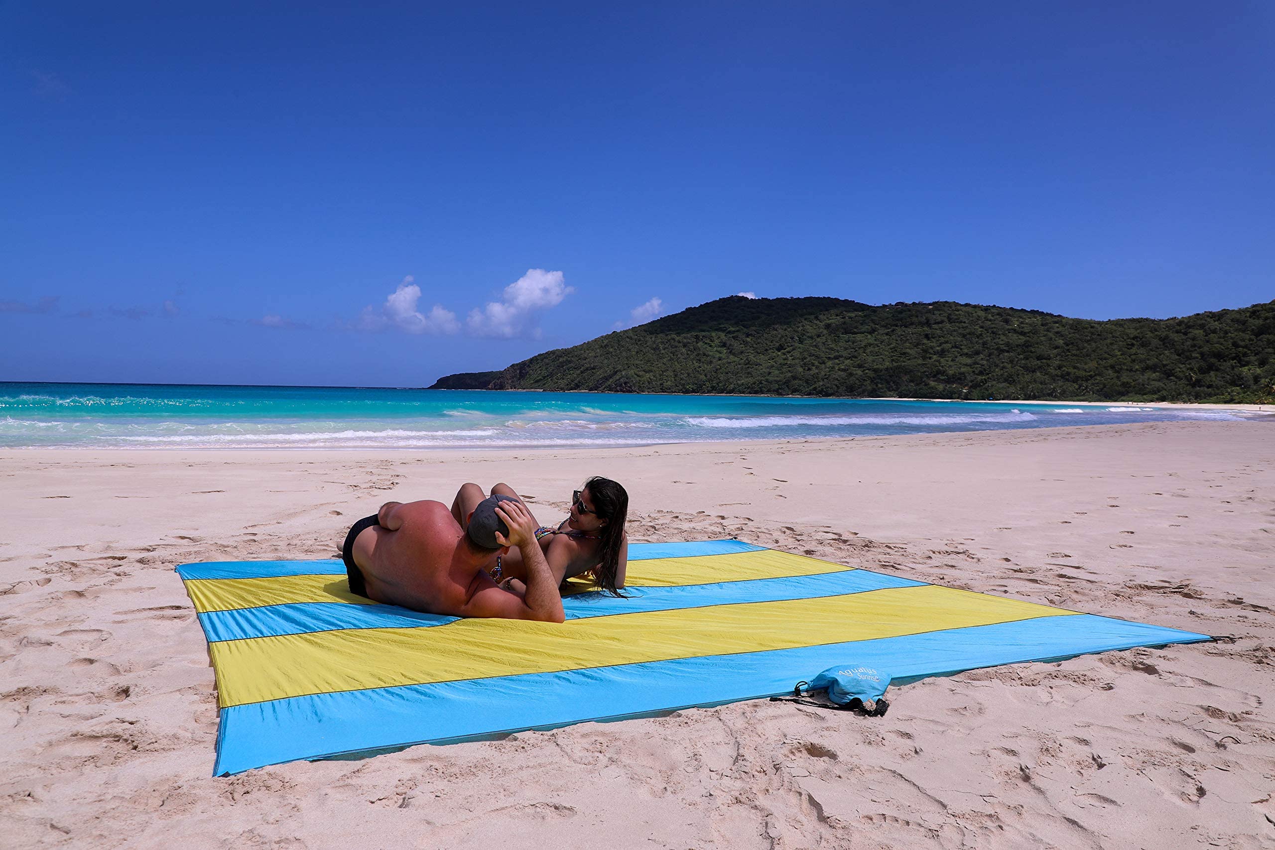 Extra Large 10ft x 9ft Sandproof Waterproof Quick Dry Beach Blanket - Portable Picnic Mat with 4 Metal Stakes & Corner Pockets for 1-8 Adults - Includes Carrying Bag & Secure Clip - Perfect for Beach, Park, Camping and Outdoor Activities