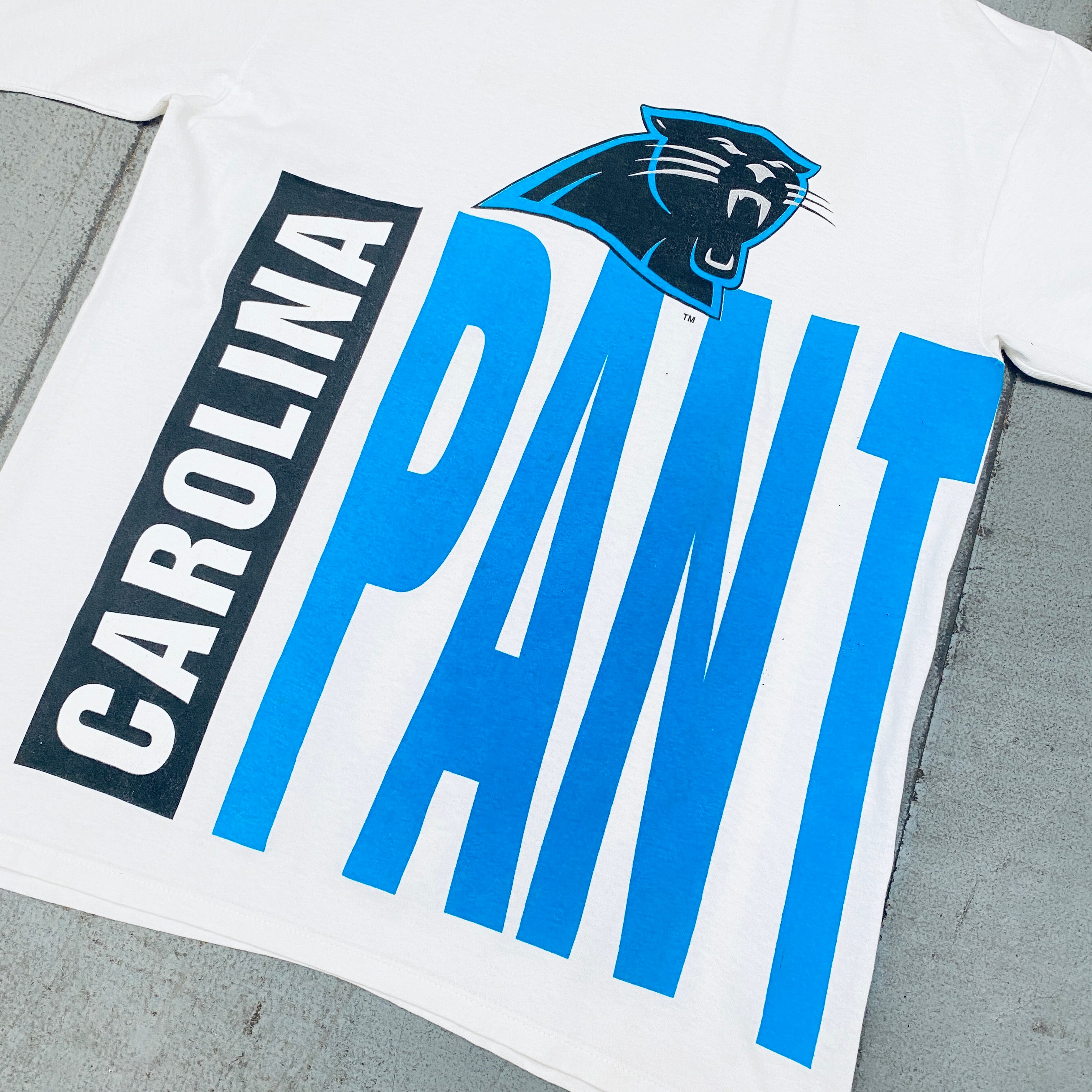 Carolina Panthers 1993 Vintage Team Announce All Over Spellout Starter T-Shirt (Large) - Perfect for Game Day, Fan Events, and Retro Sports Fashion
