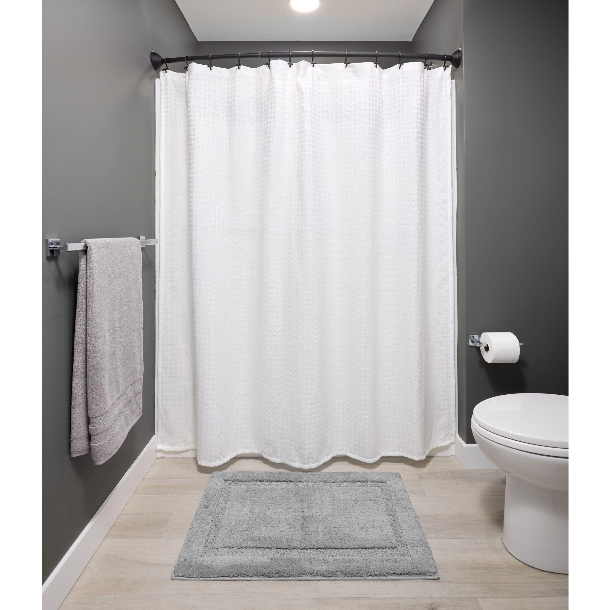 iDesign Adjustable Curved Metal Shower Curtain Rod 41-72 Inches - Matte Black Bathroom Accessory for Bathtub, Stall, Closet & Doorway | Rust-Resistant & Customizable Length | Perfect for Small Bathrooms & Walk-In Showers