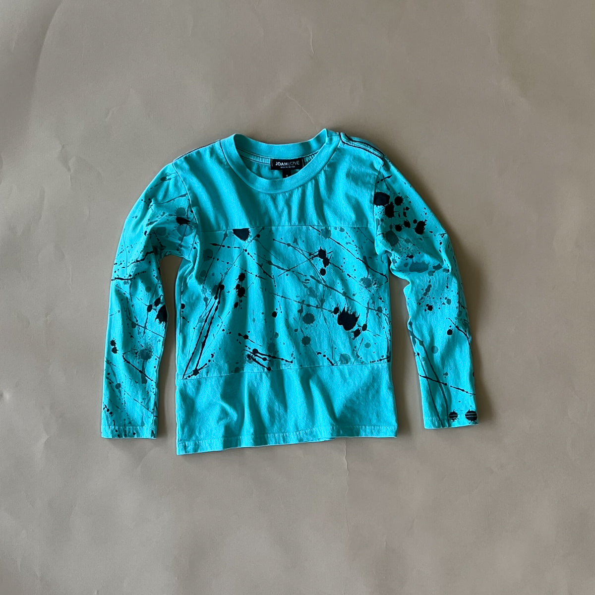 Ollie Splatter Graphic Tee for Men & Women | Aqua Blue Casual T-Shirt | Trendy Streetwear for Everyday Outfits & Summer Fashion