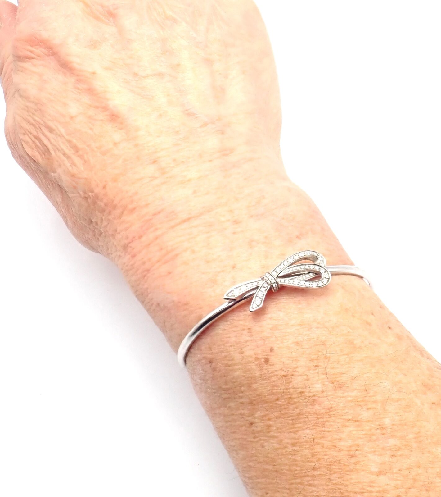 Authentic Tiffany & Co 18K White Gold Diamond Bow Ribbon Bangle Cuff Bracelet - Elegant Jewelry Gift for Women, Perfect for Weddings, Anniversaries & Special Occasions