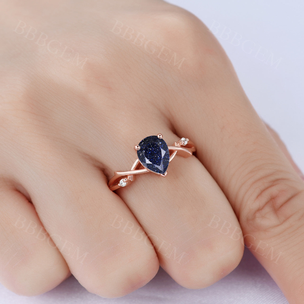 1.25ct Pear Cut Galaxy Blue Sandstone Wedding Ring in 14K Pink Gold with Diamond Accents - Elegant Twist Design for Engagement, Anniversary & Bridal Jewelry Gifts
