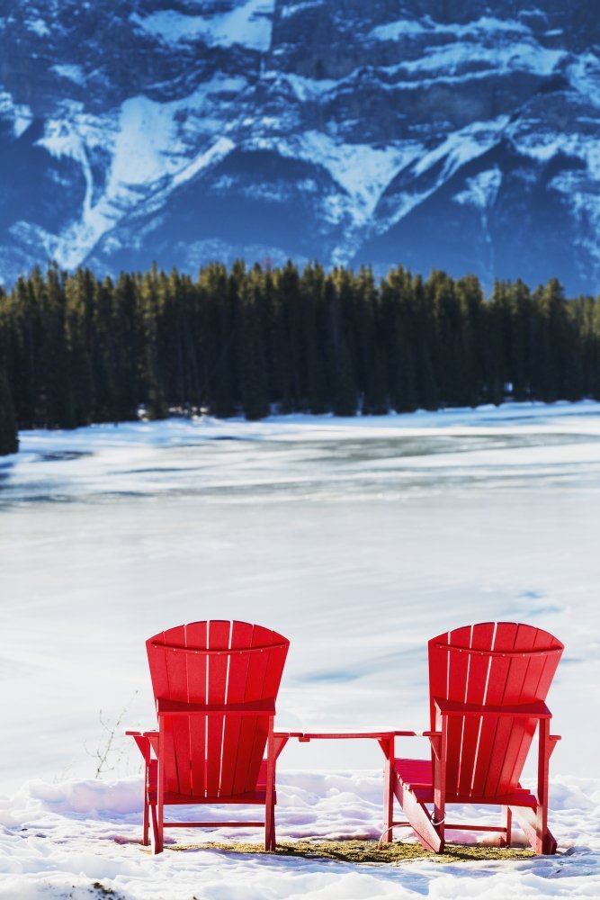 Two Red Chairs on Snowy Ridge Overlooking Frozen Lake with Mountain Cliff - 24x38 in Large Wall Art Poster Print - Perfect for Living Room, Bedroom & Office Decor