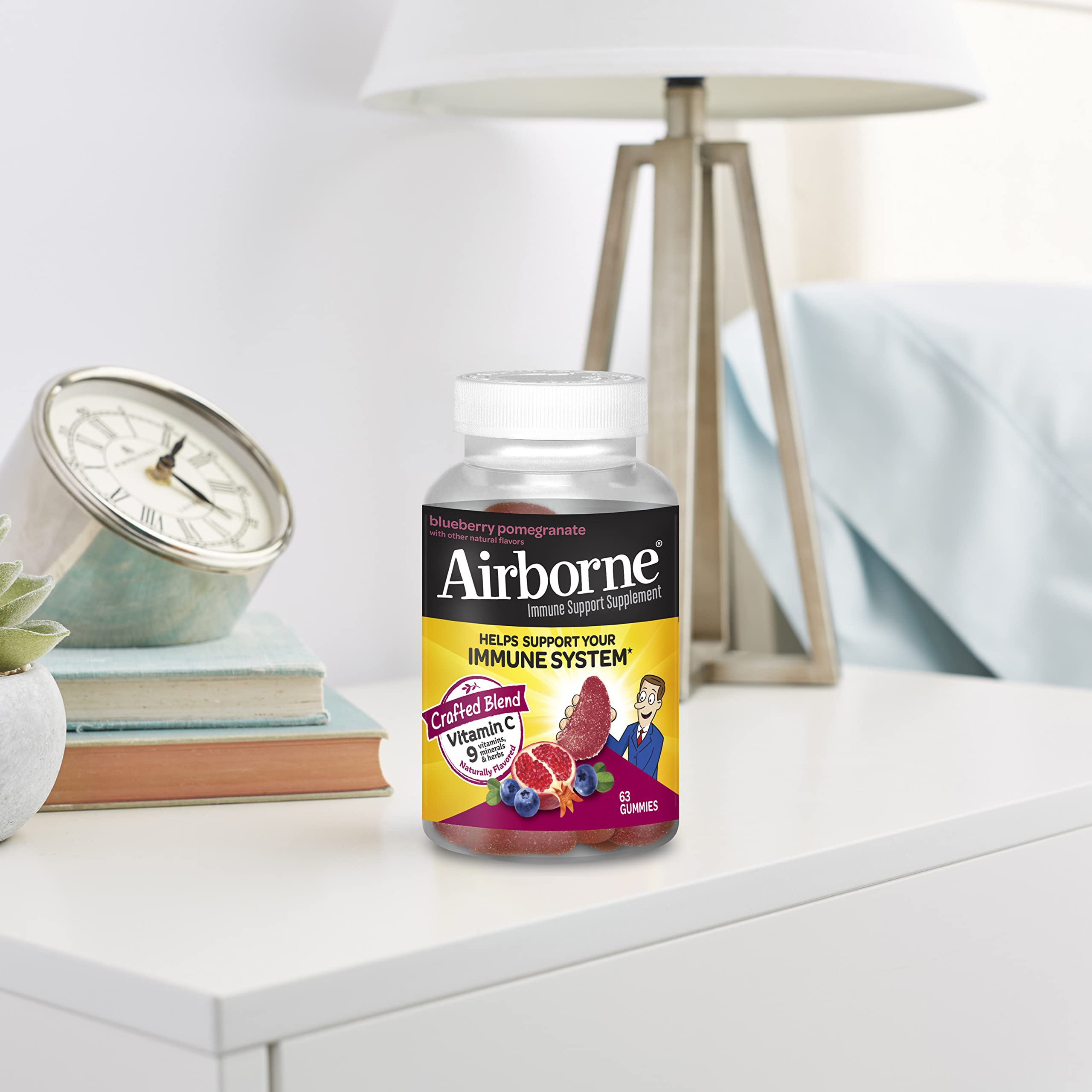 Airborne 750mg Vitamin C Gummies for Adults - Immune Support Supplement with Antioxidants Vitamins A, C & E - 63 Count Blueberry Pomegranate Flavor Gummy Vitamins - Boost Immunity & Energy for Workouts, Travel & Daily Wellness