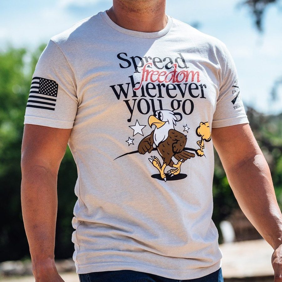 Spreading Freedom Graphic T-Shirt - Patriotic American Flag Design - Comfortable Cotton Tee for Men & Women - Perfect for 4th of July, Veterans Day & Political Events