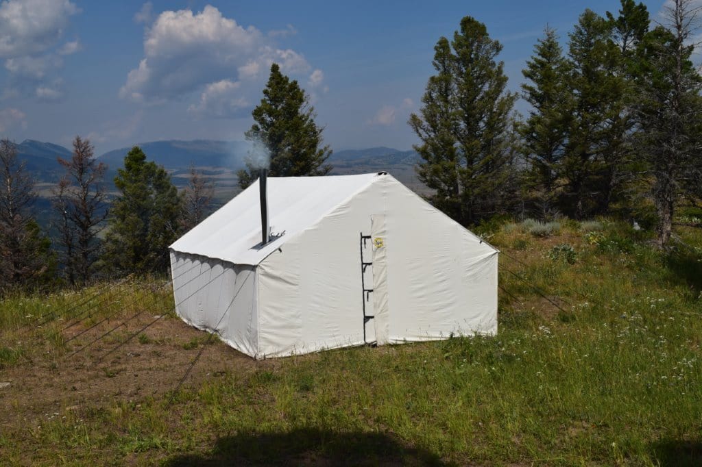 Montana Canvas Outfitter Wall Tent - Heavy Duty Waterproof Camping Tent for Outdoor Adventures, Hunting & Glamping - Spacious Canvas Shelter with Stove Jack & Mesh Windows