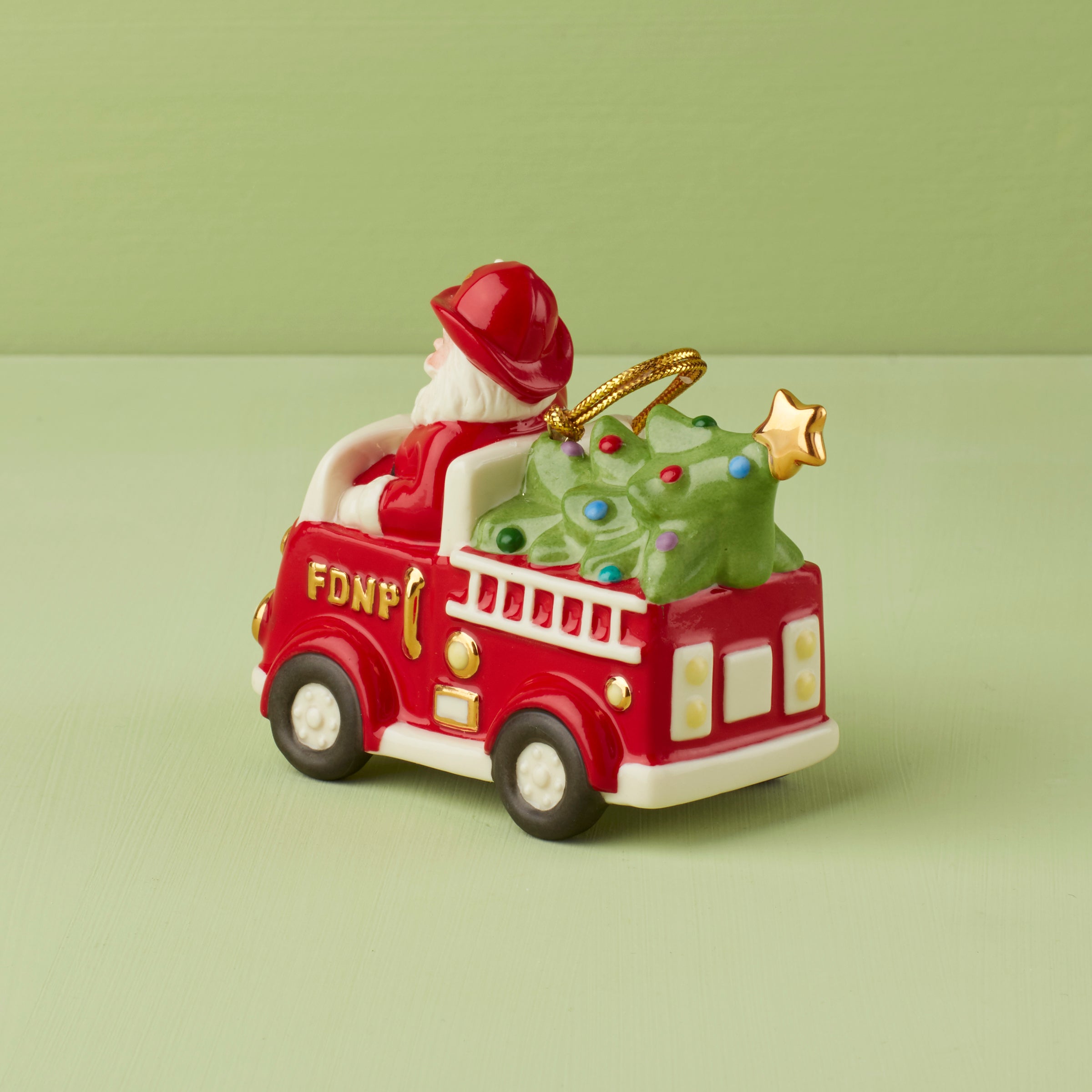 Santa in Fire Truck Christmas Ornament - Festive Holiday Decor for Tree, Gift, and Home Decoration
