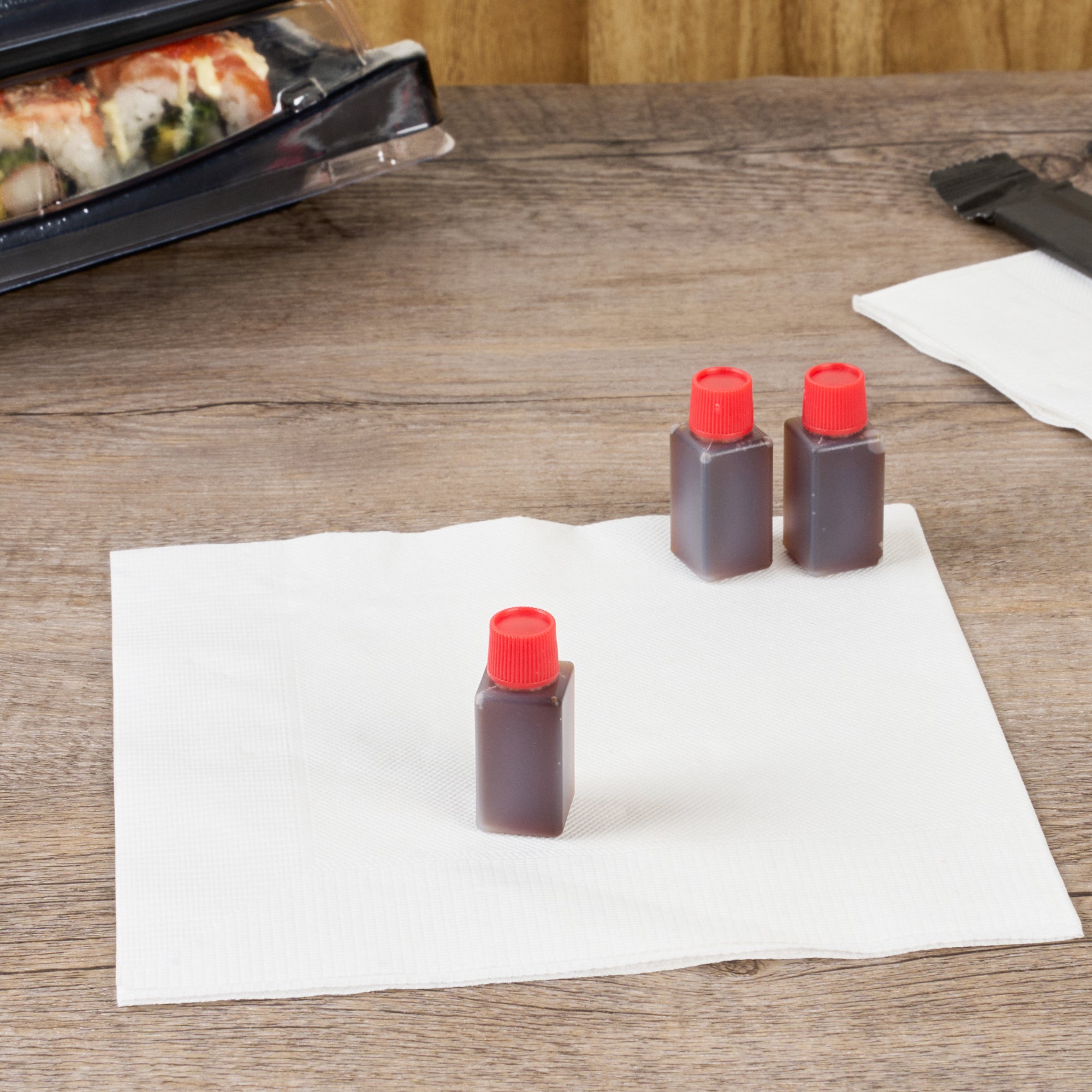 Bento Tek 6mL Clear Plastic Soy Sauce Bottles with Red Caps - 1/2