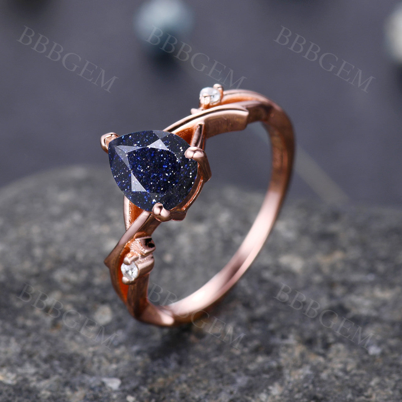 1.25ct Pear Cut Galaxy Blue Sandstone Wedding Ring in 14K Pink Gold with Diamond Accents - Elegant Twist Design for Engagement, Anniversary & Bridal Jewelry Gifts