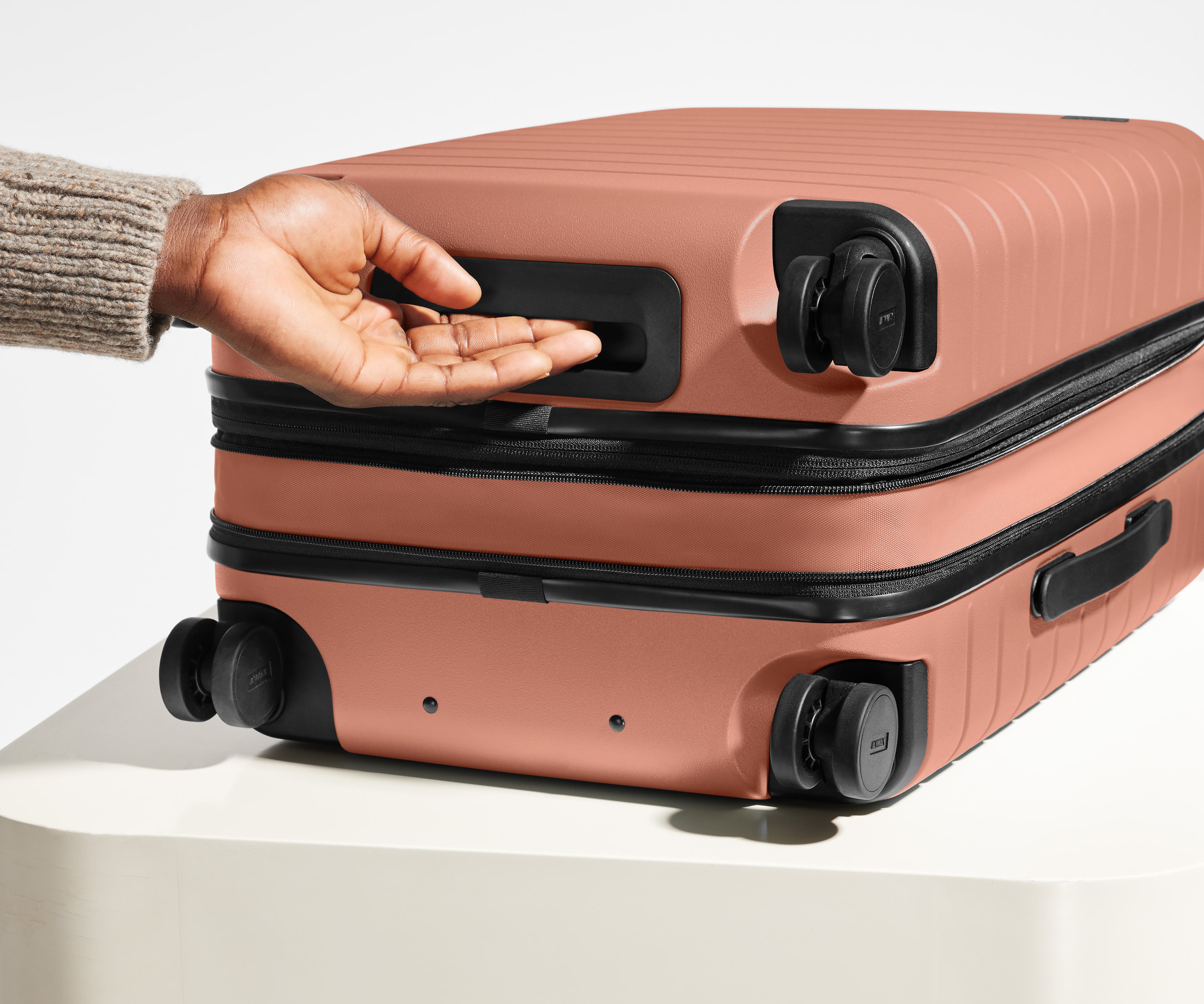 The Carry On Flex in Clay Pink - Lightweight Expandable Luggage for Travel, Business Trips & Weekend Getaways