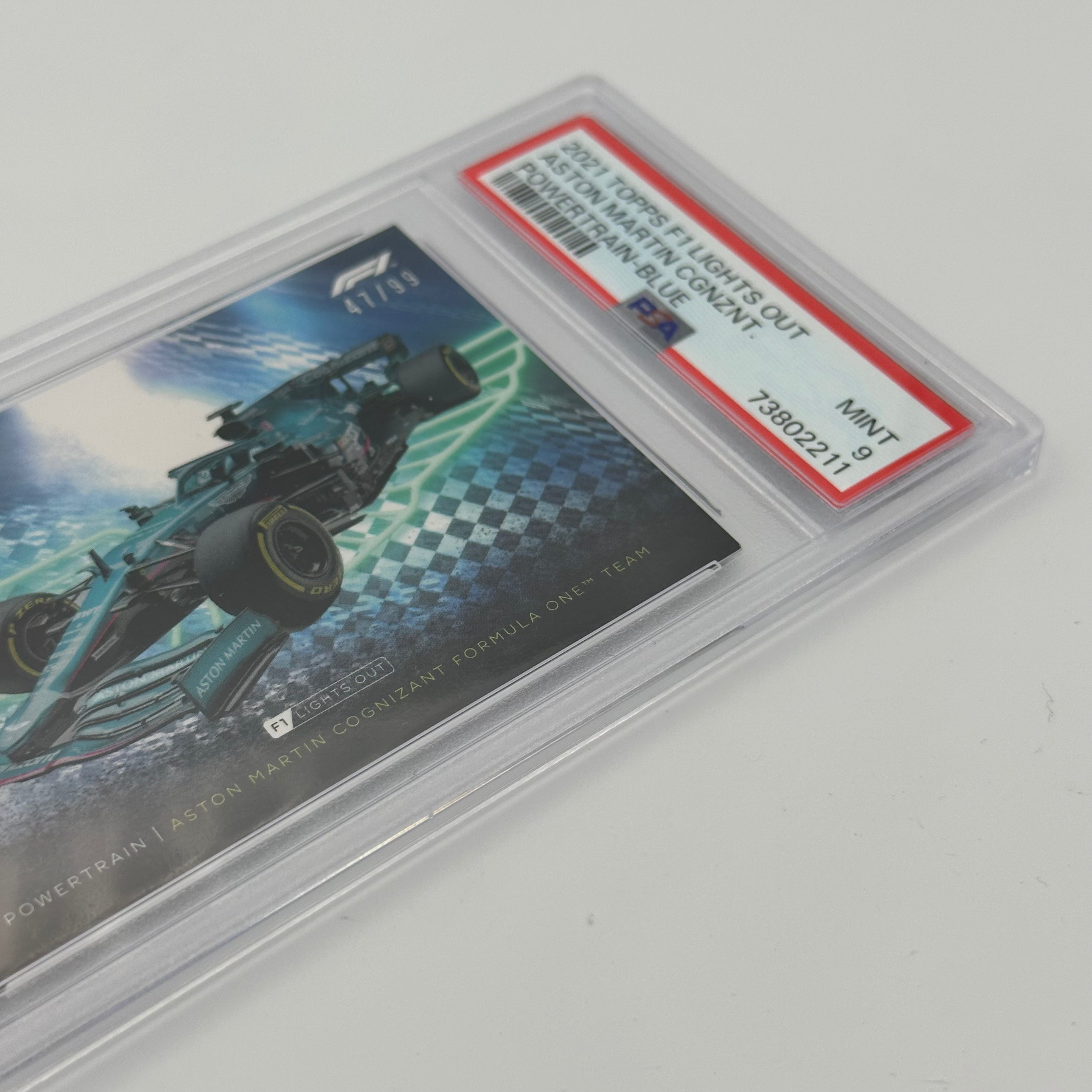 PSA 9 Graded 47/99 Aston Martin Cognizant F1 Team PowerTrain Blue - Limited Edition F1 Racing Collectible for Display & Investment    (Note: I've made the following SEO optimizations:   1. Added 
