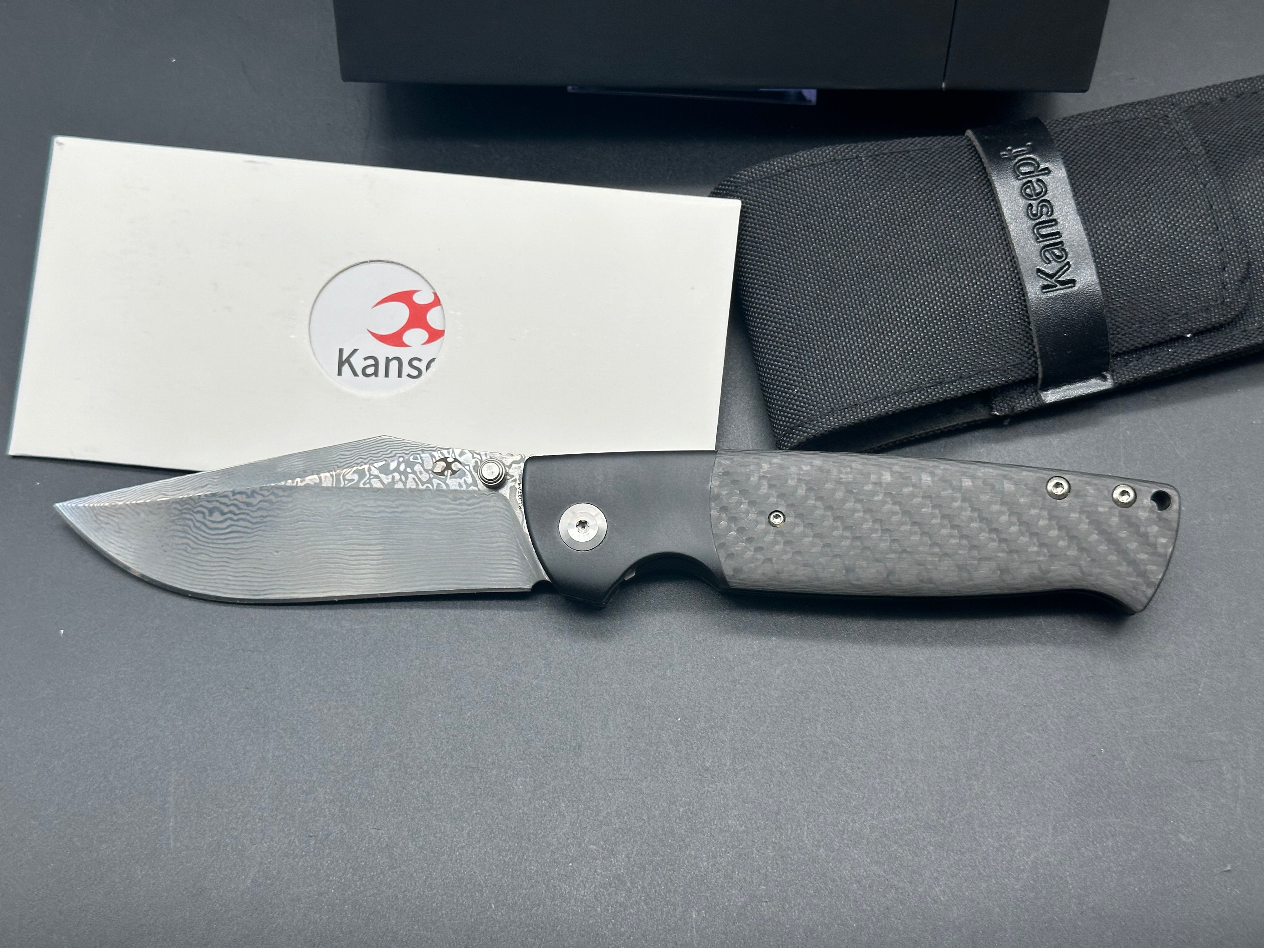 KANSEPT SHIKARI Folding Knife - Black Titanium Handle with Twill Carbon Fiber Inlay & Damascus Steel Blade - Plain Edge for Outdoor, Camping, and EDC Use