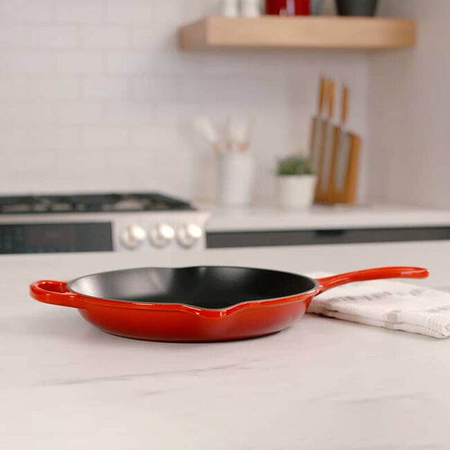 Le Creuset 10.25 Inch Round Cast Iron Skillet Grill Pan - Flame Color - Perfect for Stovetop, Oven & Outdoor Grilling - Ideal for Steaks, Burgers & Vegetables