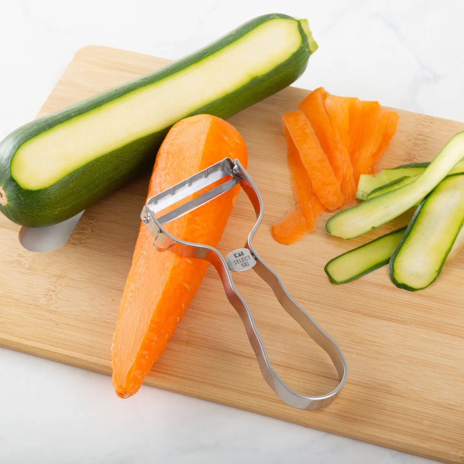 Premium Kai Stainless Steel Vegetable Peeler - Ergonomic Kitchen Tool for Effortless Peeling of Potatoes, Carrots & Fruits - Ideal for Home Cooking & Professional Chefs