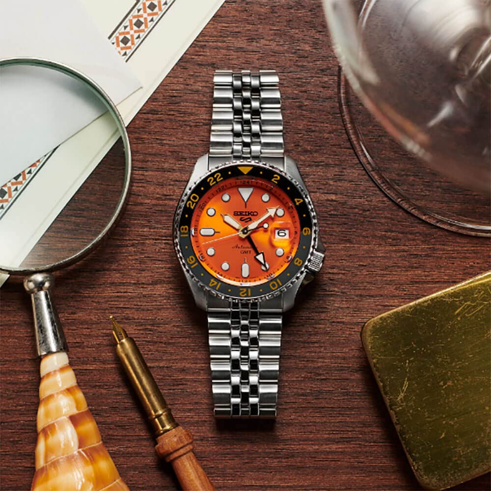 Seiko SSK005 Men's Automatic GMT Sports Watch - Orange Dial, Date Calendar, Luminous Hands & Markers, Gray GMT Bezel, 100m Water Resistant - Perfect for Travel, Diving & Everyday Wear