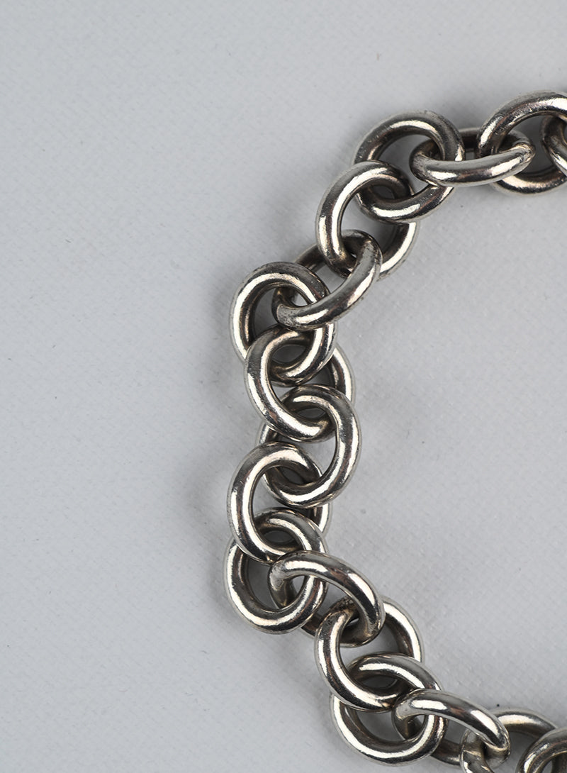Tiffany & Co. Sterling Silver Bracelet with Round Charm - Elegant Jewelry Gift for Women, Perfect for Anniversaries & Special Occasions