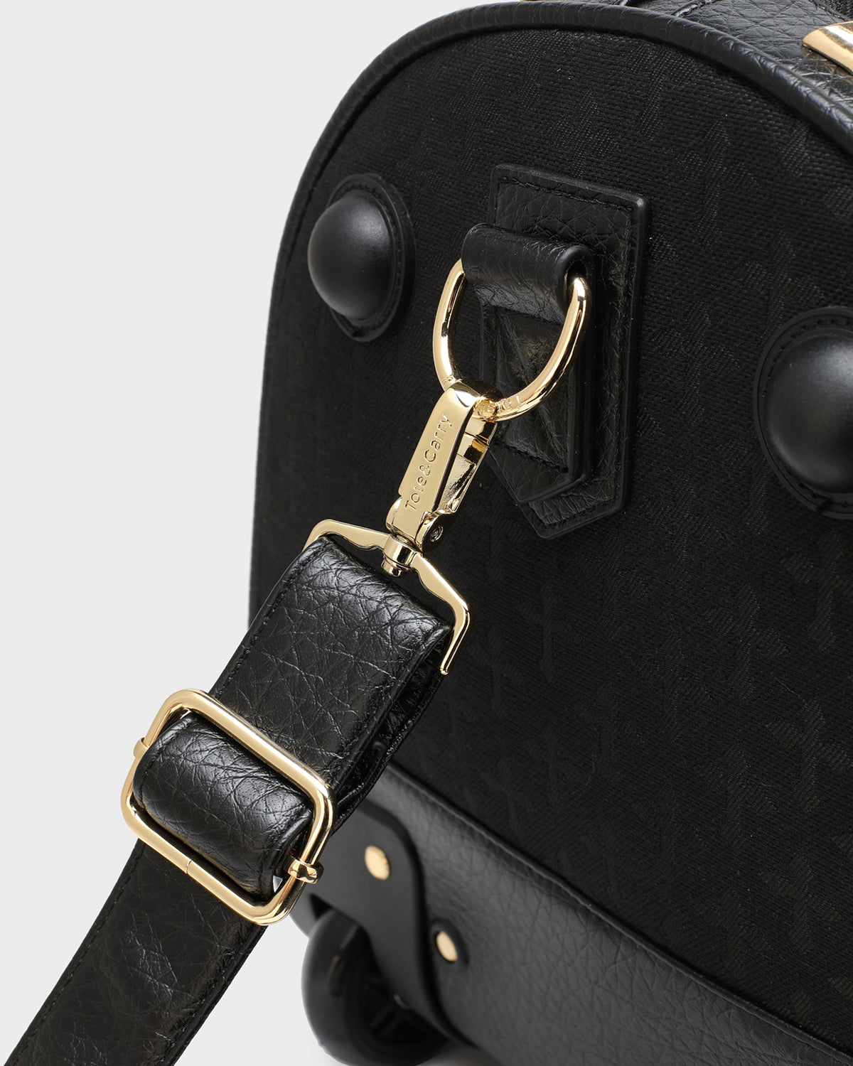 Black Cross Spiked Rolling Duffle Bag - Stylish Travel Luggage for Gym, Work & Weekend Getaways | Durable Wheels & Trendy Design
