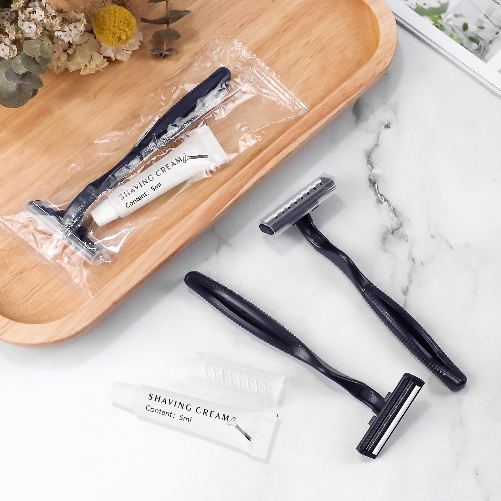 Bulk Disposable Razors with Blade Caps - 100 Pack Individually Wrapped Razors with Shaving Cream | Ideal for Hotels, Shelters, Nursing Homes & Charity Donations | Smooth Shaving for Travel & Personal Care