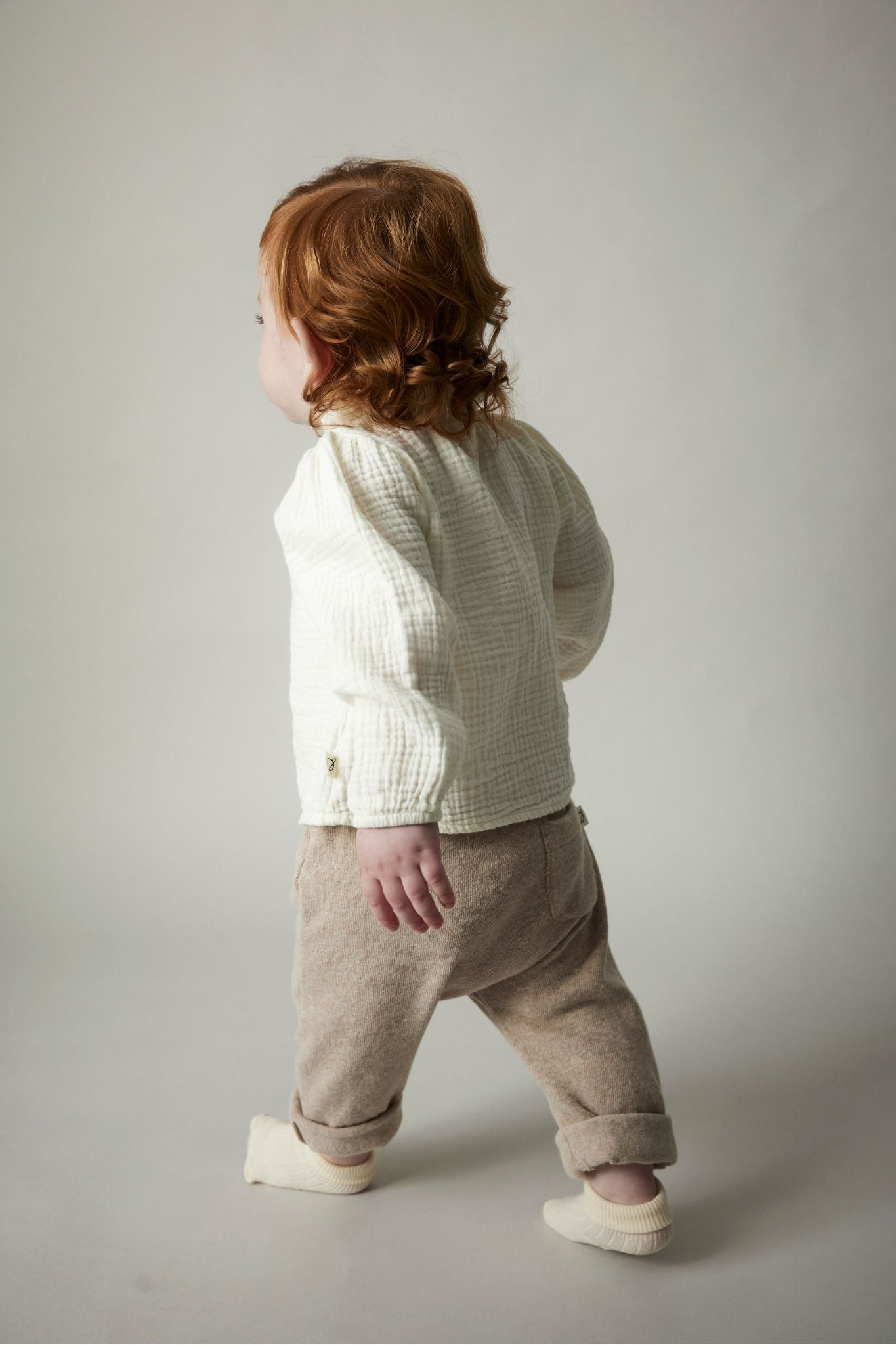 Ivory Textured Cotton Ruffle Blouse for Baby Girls | Elegant & Comfortable Top for Special Occasions, Photos & Daily Wear