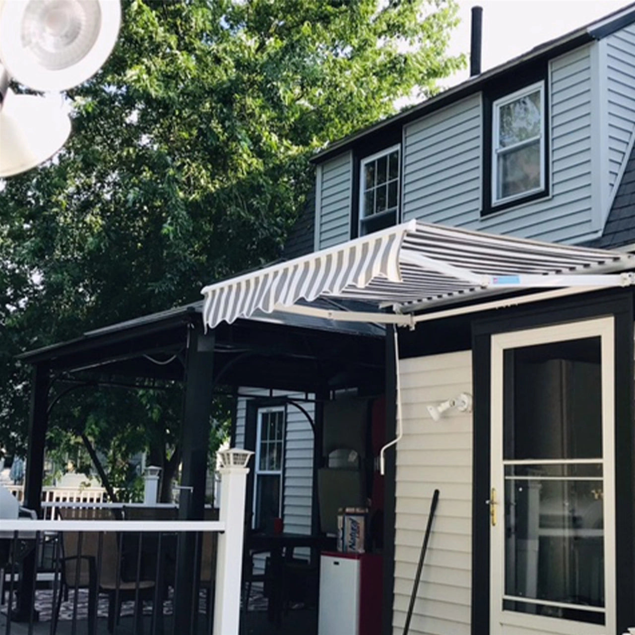 Aleko 12x10 Feet Motorized Retractable Patio Awning - White Frame with Gray & White Stripes - Perfect for Outdoor Shade, Deck, Backyard, and Poolside Relaxation