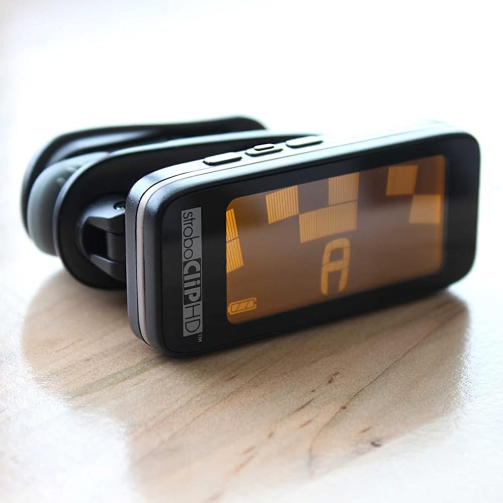 Peterson Clip Tuner StroboClip HD - Professional Clip-On Tuner for Guitar, Bass, Violin, Ukulele, Harp & Brass Instruments | Includes 12 Guitar Picks & Liquid Audio Polishing Cloth | Perfect for Live Performances, Studio Recording & Music Practice