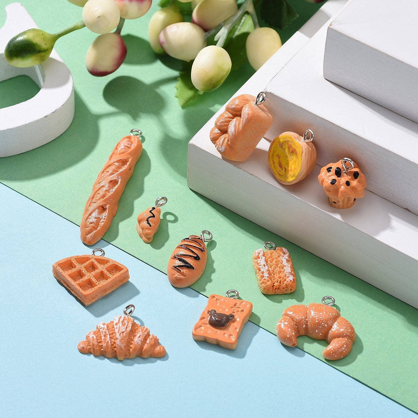 FASHEWELRY 22Pcs Resin Food Charms - 3D Croissant Bread Toast Pendants for DIY Jewelry, Earrings & Keychains - Perfect for Crafting, Gift Making and Kawaii Accessories