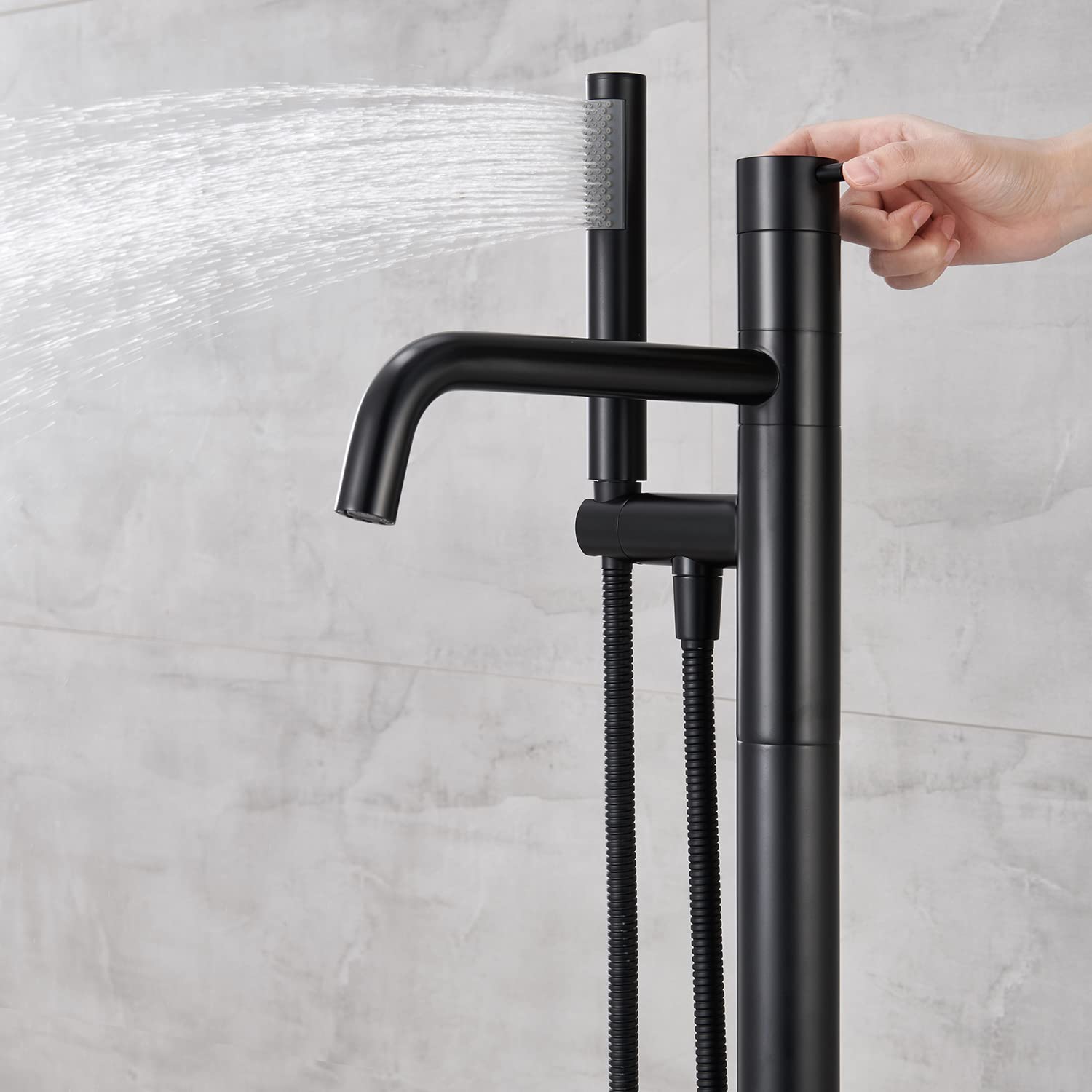 Freestanding Bathtub Faucet - Black Floor Mount Brass Single Handle Tub Filler with Hand Shower for Modern Bathroom | Perfect for Spa-Like Relaxation & Luxury Bathing Experience