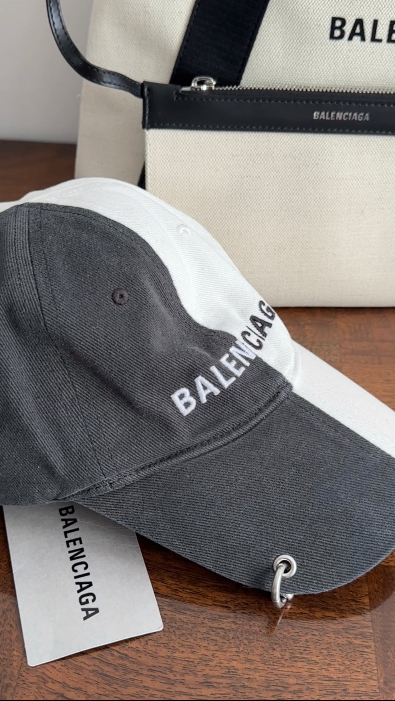 Balenciaga Dark Grey & White 50/50 Logo Piercing Hat - Unisex Baseball Cap for Streetwear Fashion & Urban Lifestyle
