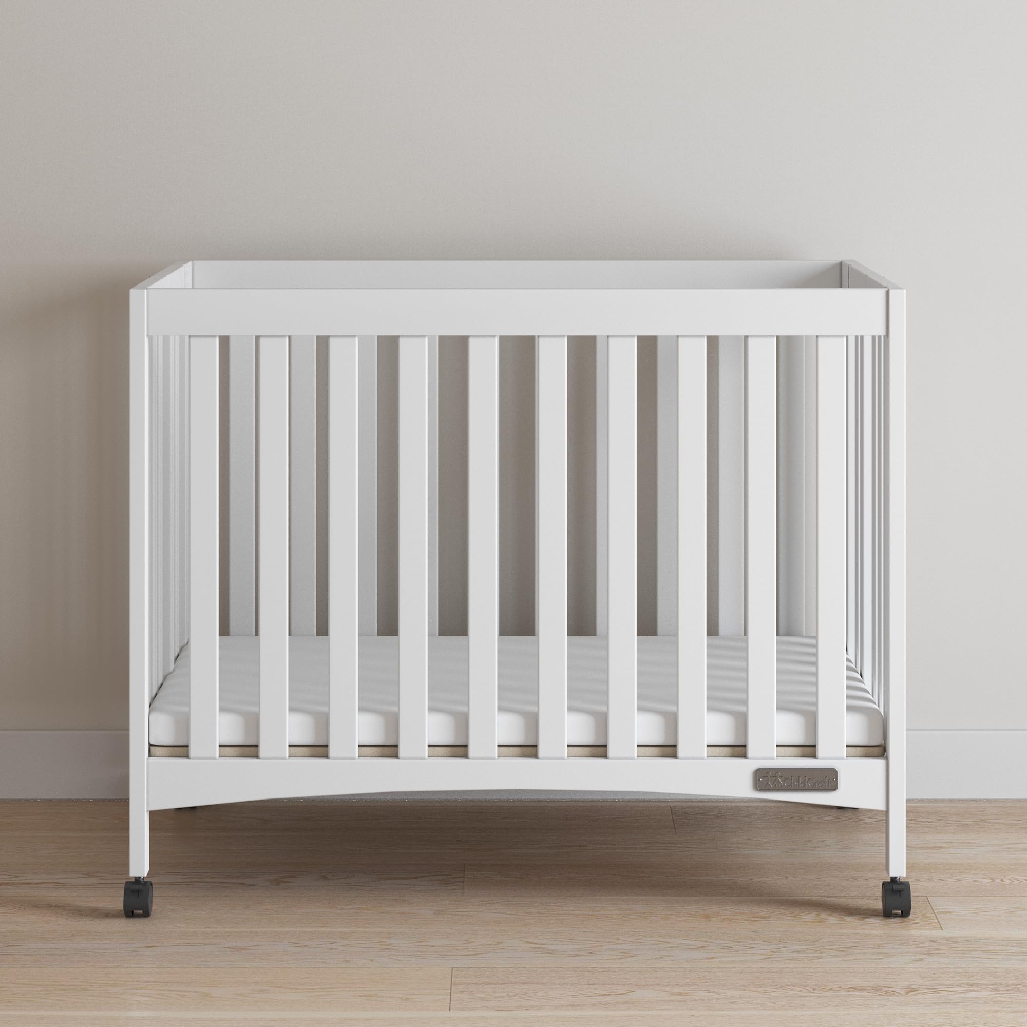 Child Craft London Mini Compact Folding Portable Crib with 2