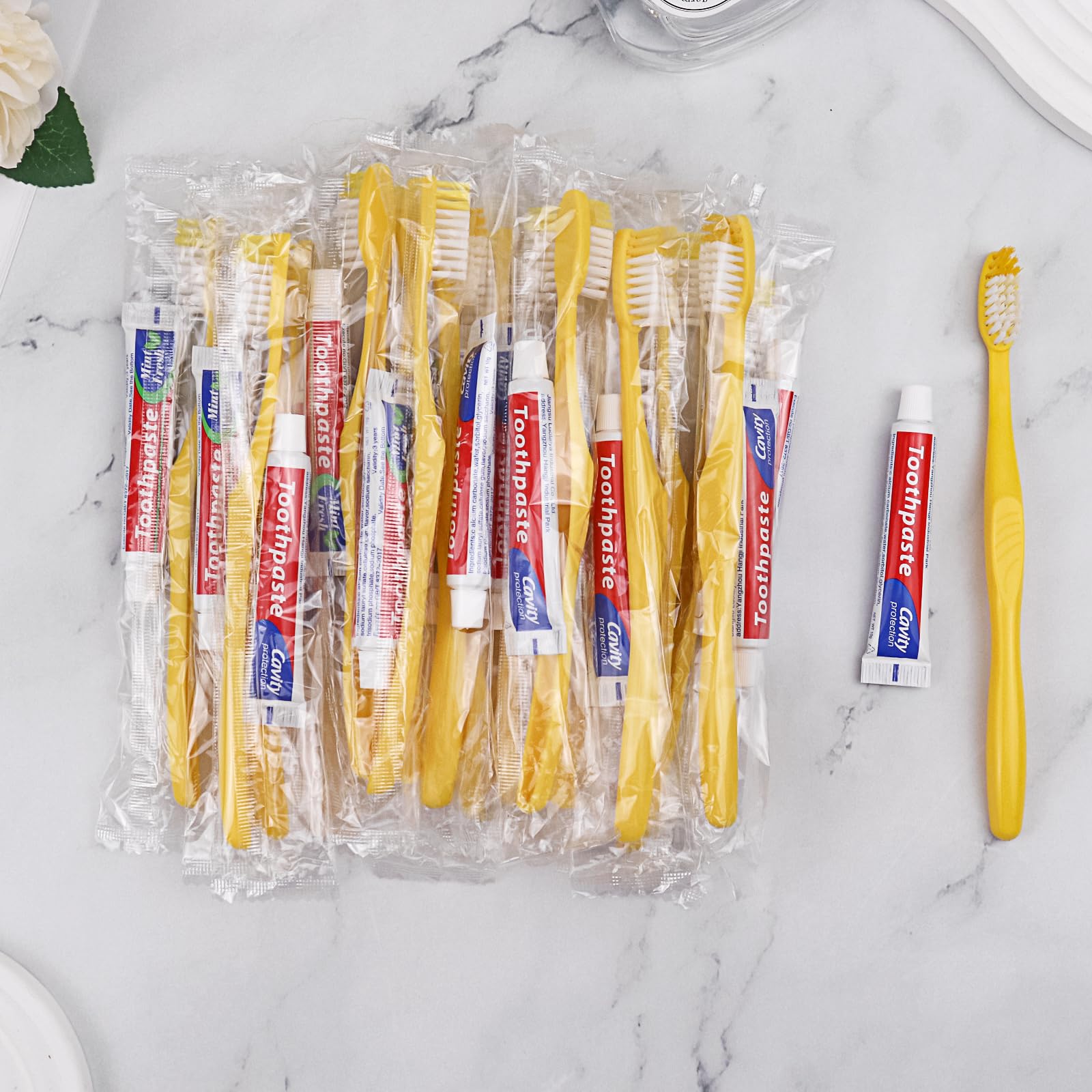 200 Pack Disposable Toothbrush with Toothpaste - Individually Wrapped Travel Toothbrush Kit (10g Toothpaste, Yellow Hollow Design) for Travel, Hotels, Airbnb, Homeless Shelters & Charity Donations - Perfect for On-the-Go Oral Care