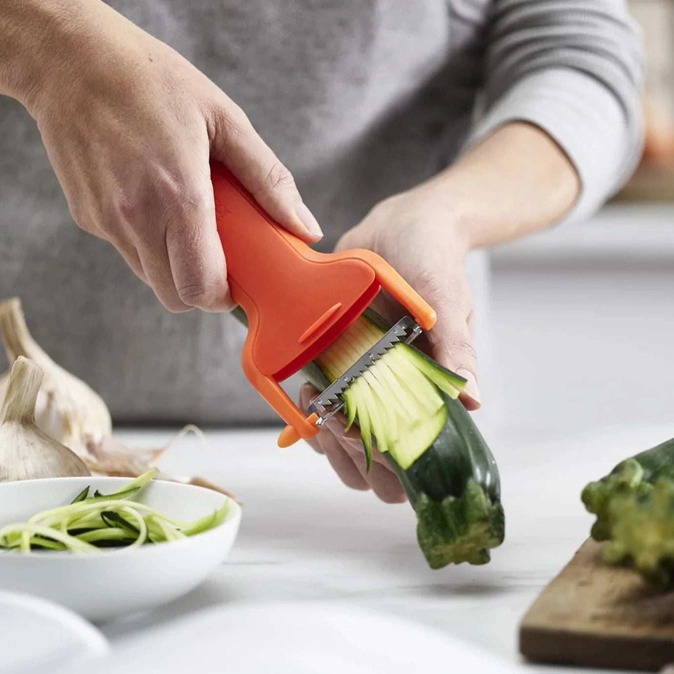 Premium Julienne Peeler with Safety Blade Guard - Stainless Steel Vegetable Slicer for Zucchini, Carrots & Salads - Perfect for Meal Prep & Healthy Cooking (Orange)