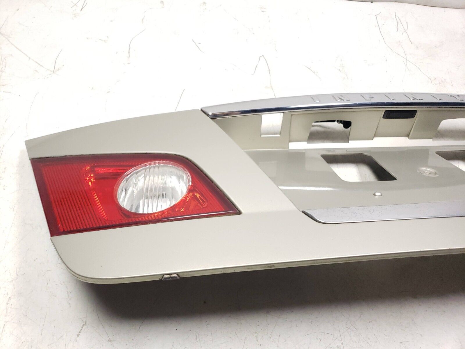 06-09 Infiniti M35 Trunk Trim Molding & License Plate Panel - OEM Replacement Part for Car Body Repair & Customization