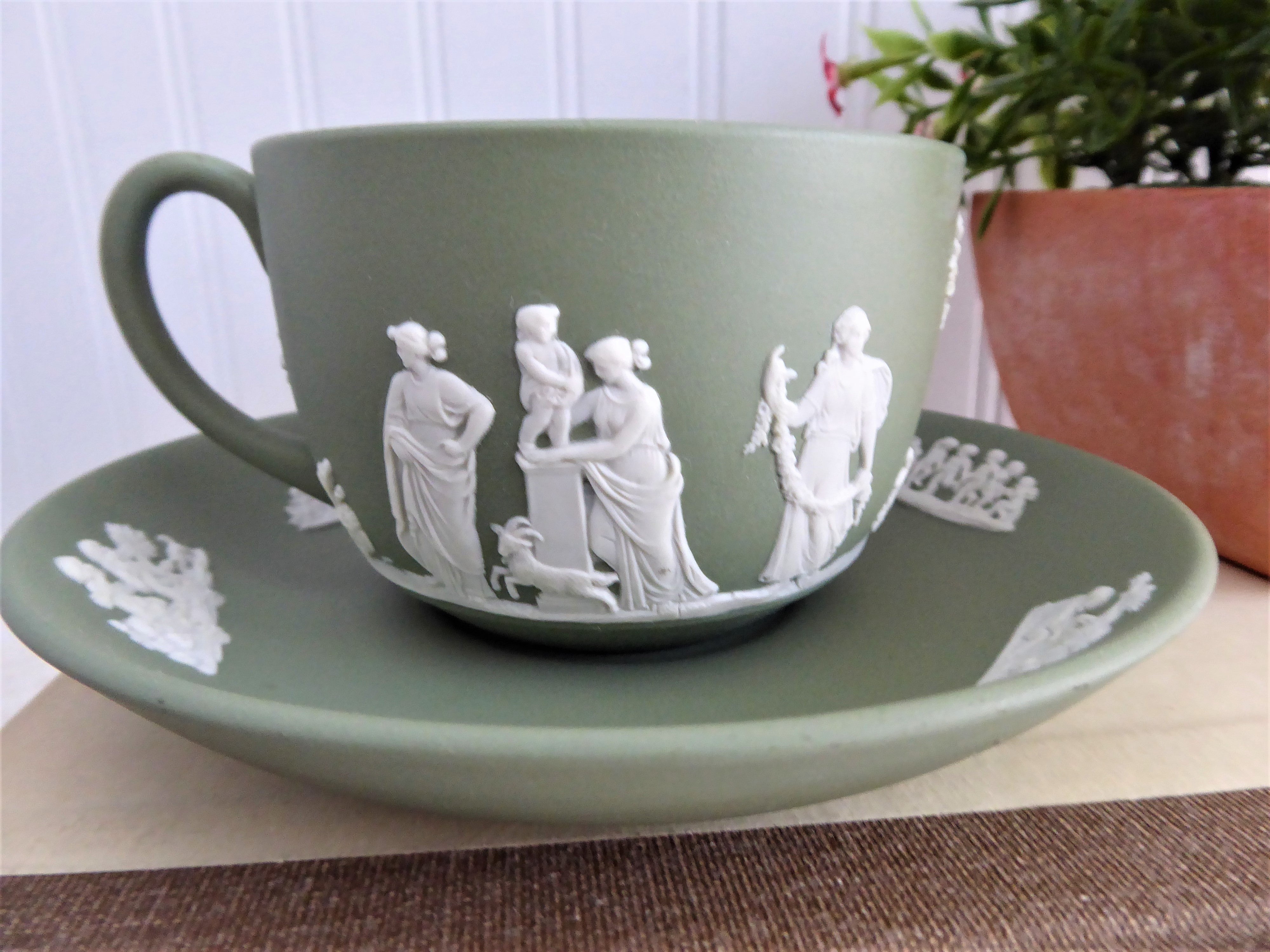 Vintage Wedgwood Green Jasperware Cup and Saucer Set with Cherub Sacrifice Figures - Made in England 1970s - Perfect for Tea Time, Collectible Display, and Wedgwood Enthusiasts