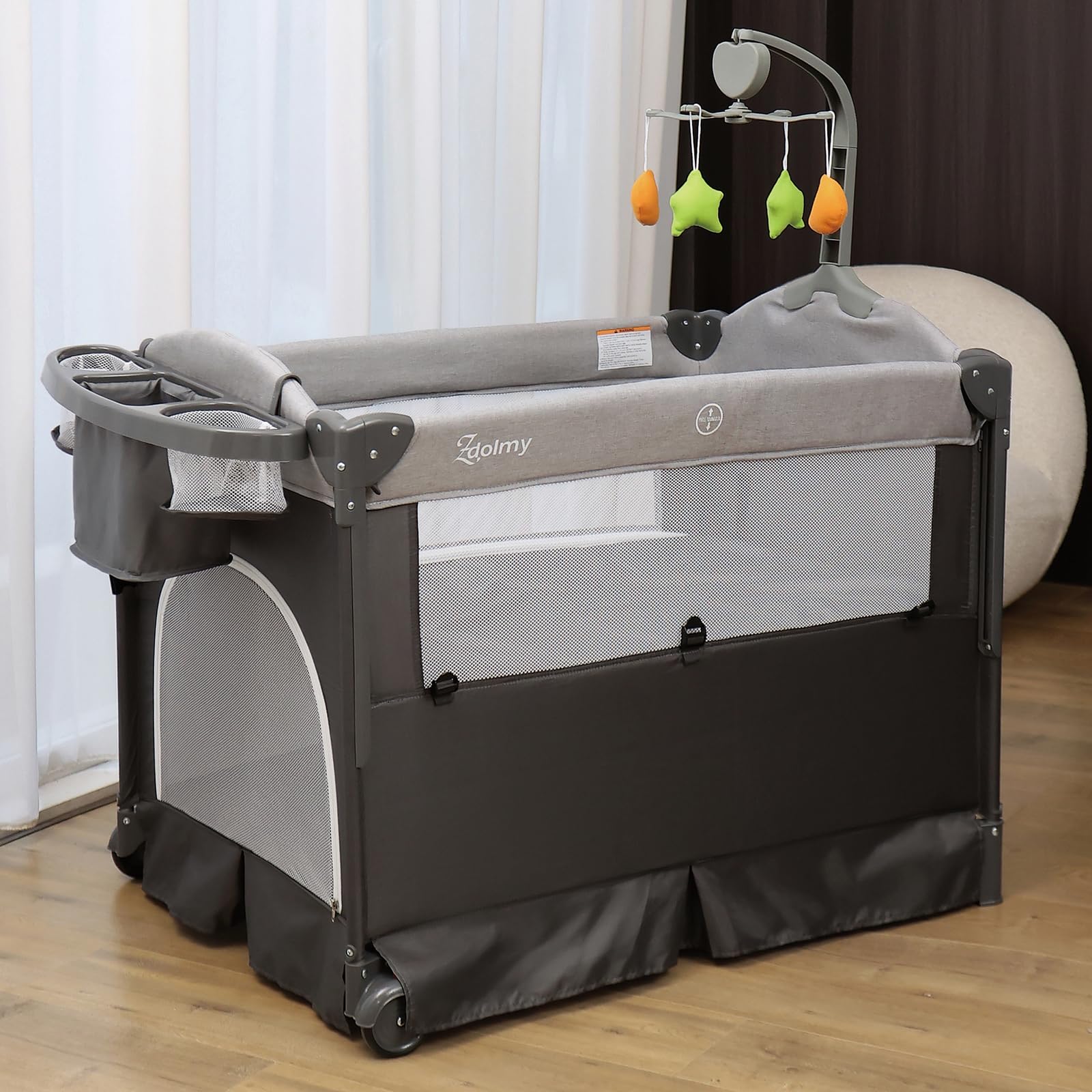 **Zdolmy 4-in-1 Baby Bedside Sleeper Bassinet & Play Yard – Adjustable Height, Diaper Changing Table, Storage Bag, Toy Arch & Music – Portable Crib for Newborns & Infants – Perfect for Nursery, Travel & Co-Sleeping**