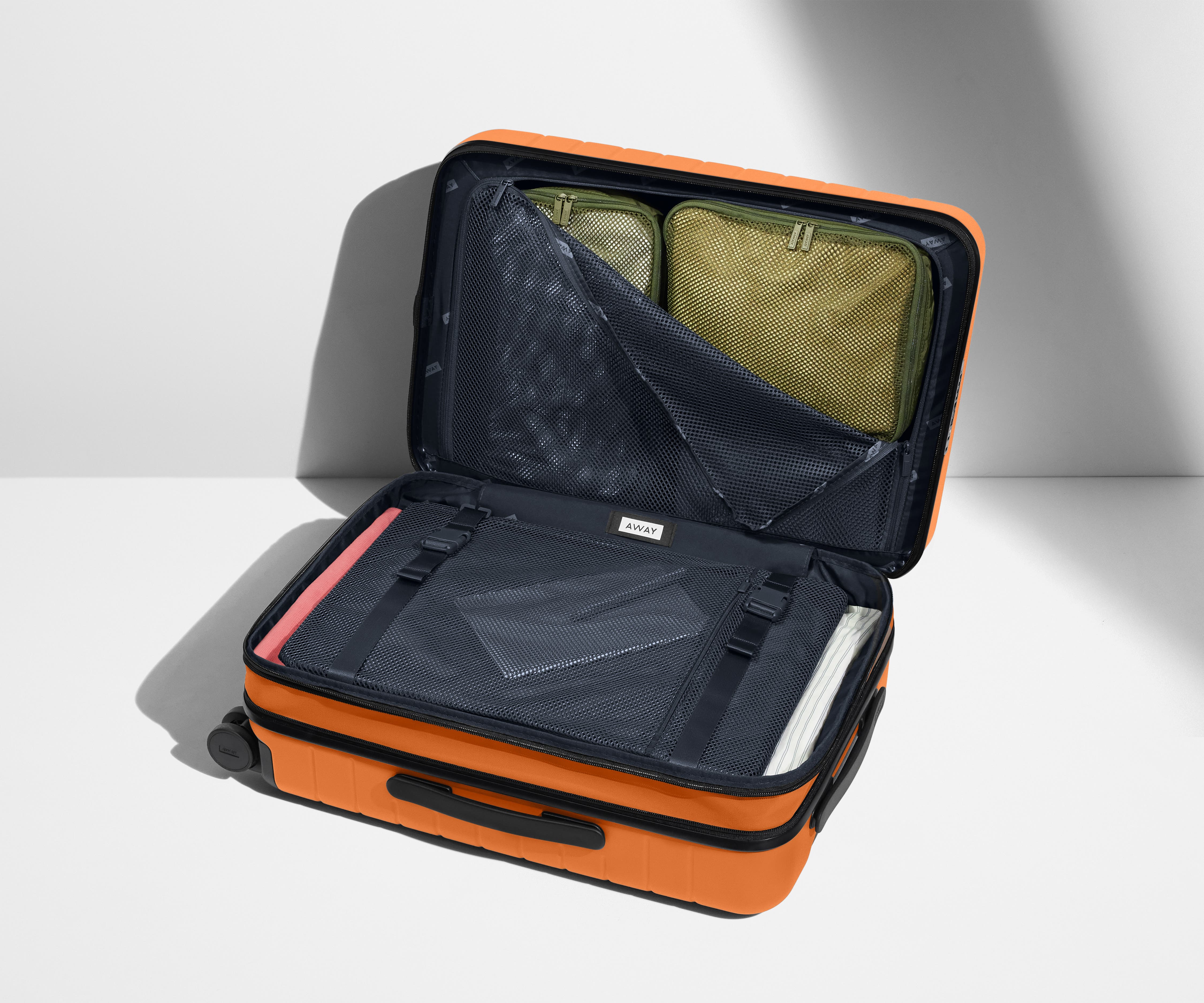 The Carry On Flex in Sorbet Orange - Lightweight Expandable Suitcase for Travel, Business & Weekend Getaways | Perfect for Airplane Cabin & Road Trips