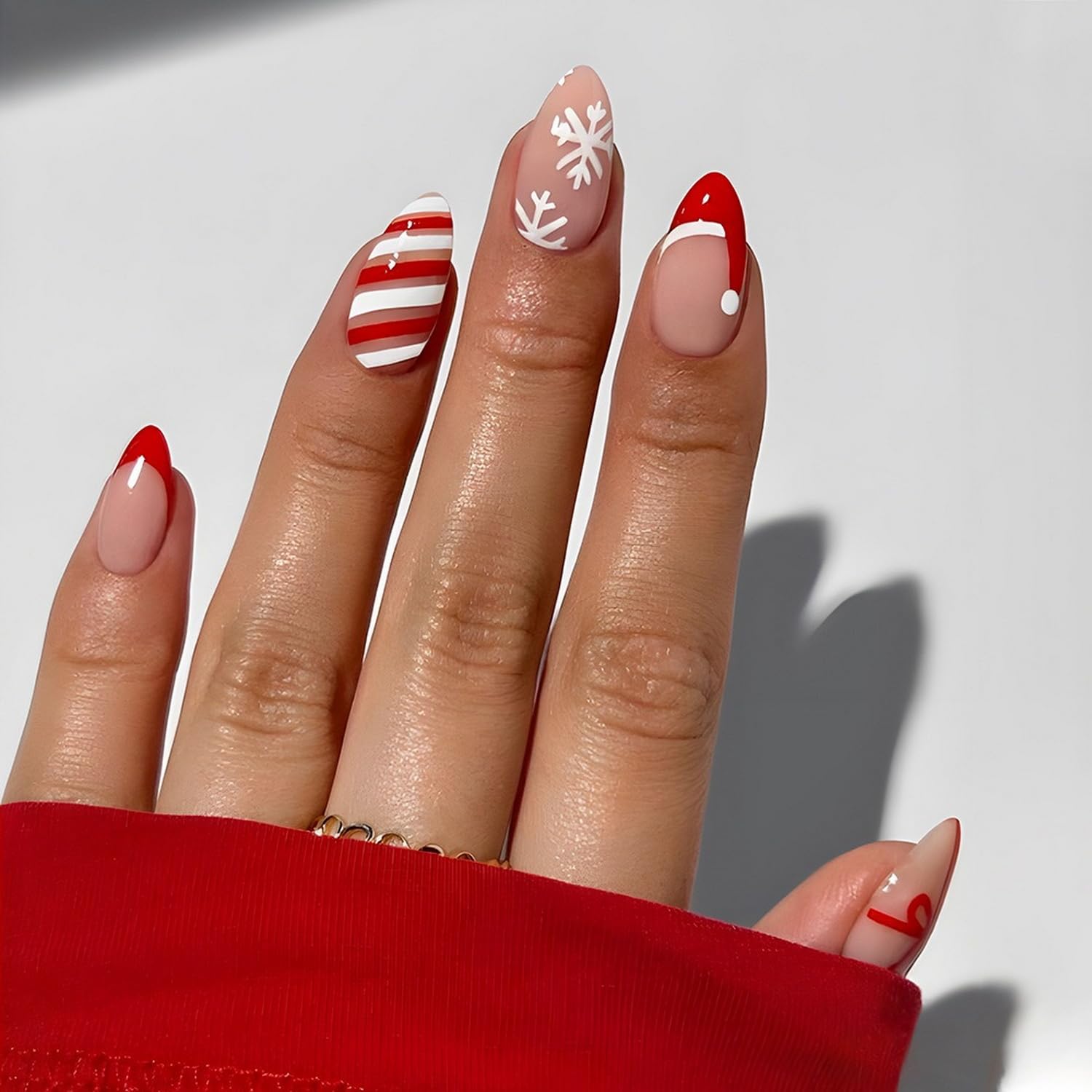 Christmas Press on Nails Short Almond Fake Nails - Xmas Red & White Stripes with Snowflake Santa Hat Bow Design - 24Pcs Full Cover Acrylic Nails Kit for Women - Perfect for Holiday Parties, Gift Giving & Festive Manicures
