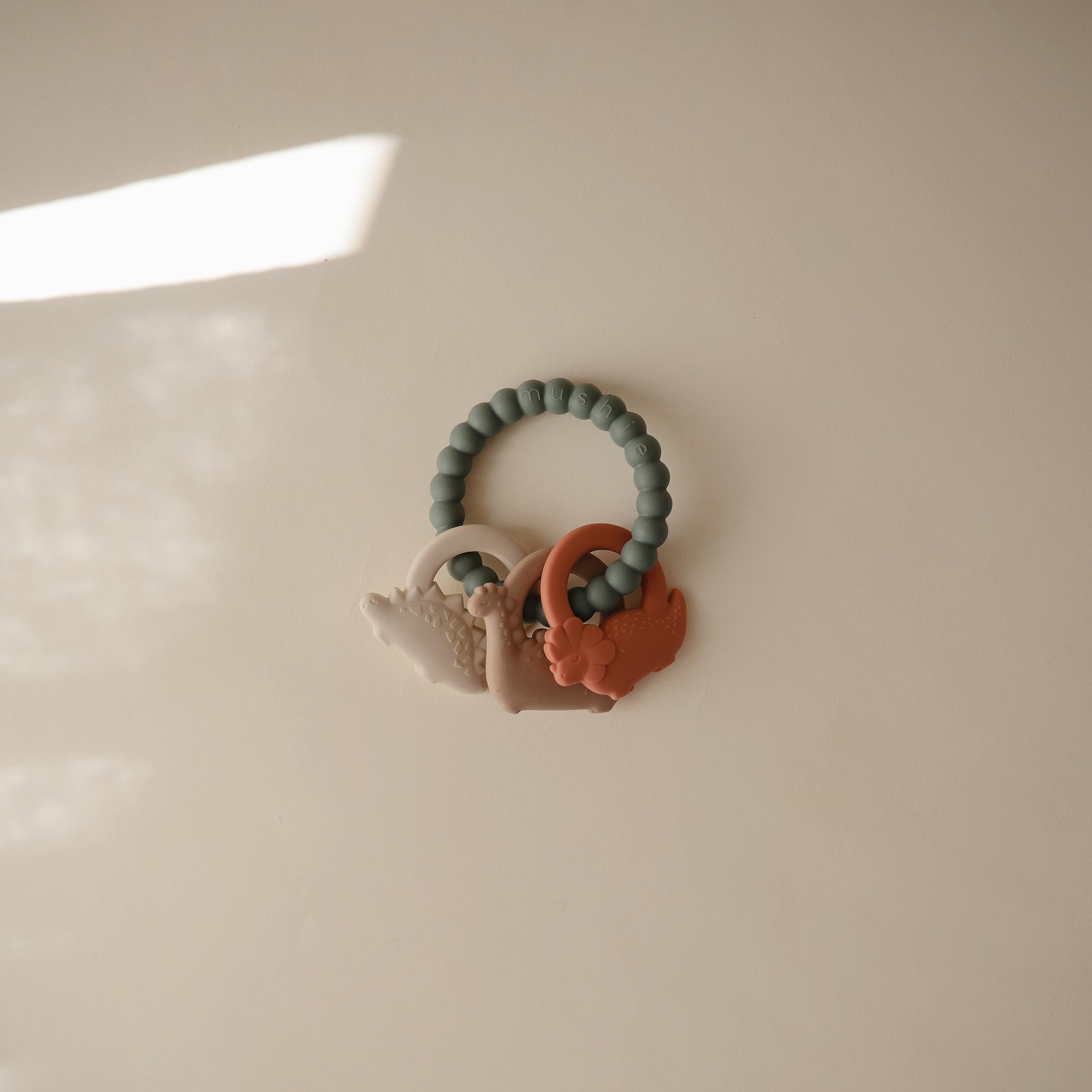 mushie Silicone Dino Teething Ring Toy for Babies - Safe & BPA-Free Chew Toy for Soothing Sore Gums - Perfect for Teething Infants & Toddlers at Home or On-the-Go