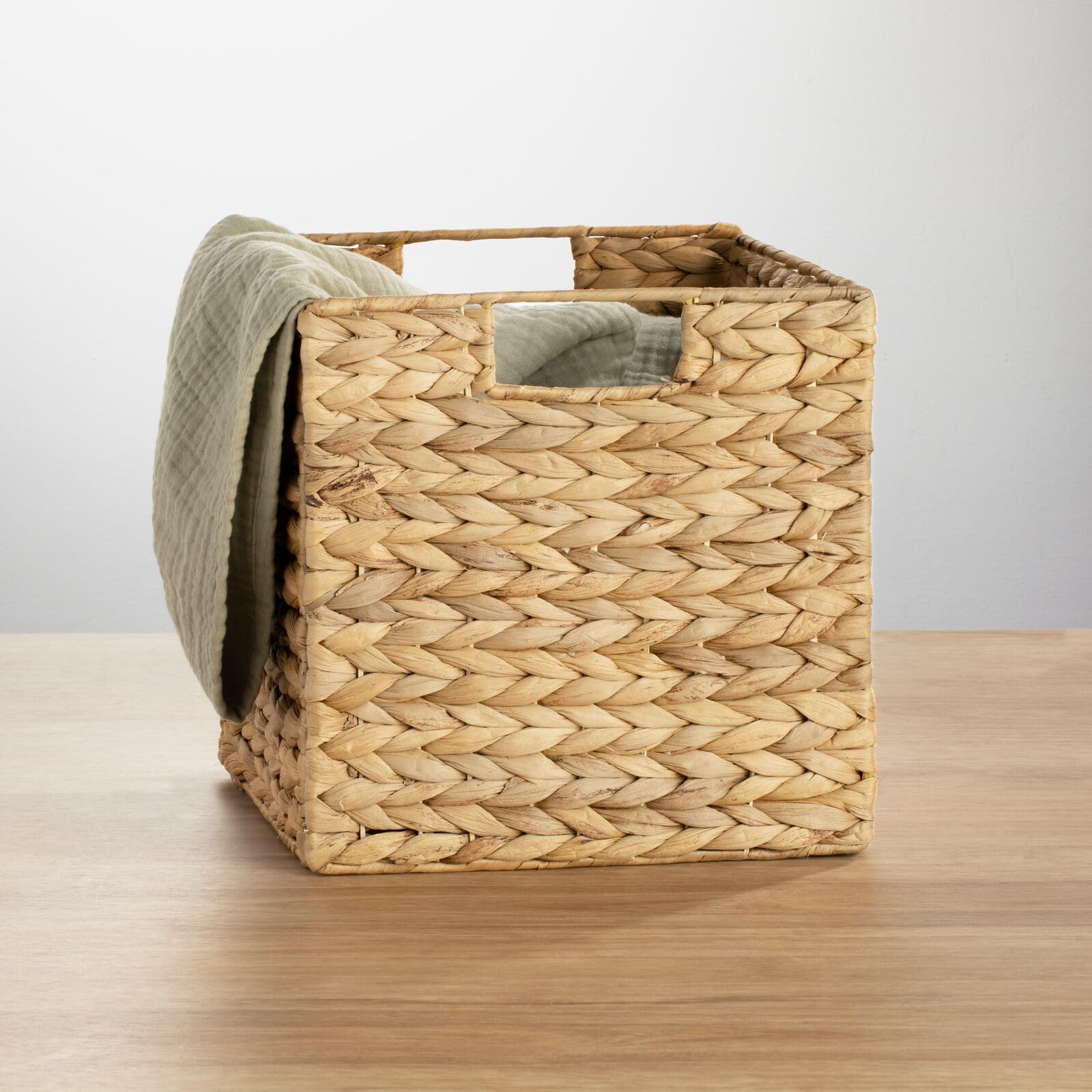 mDesign Natural Woven Hyacinth Cube Organizer Basket with Handles - 4 Pack Storage Bins for Bathroom, Laundry Room, Nursery & Cubby Units - Perfect for Organizing Blankets, Books & Home Essentials | Space-Saving Home Decor Solution