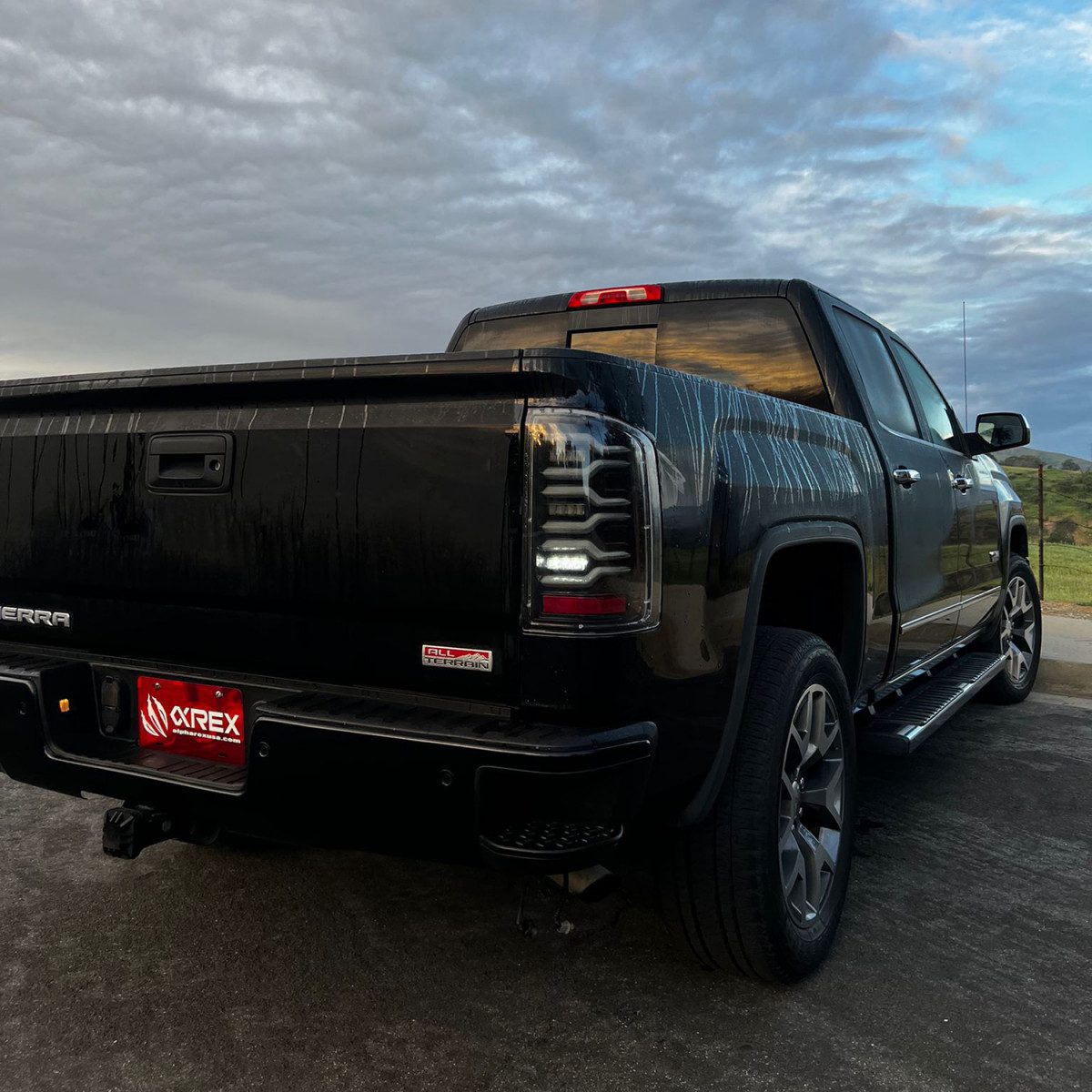 14-18 GMC Sierra 1500/2500HD/3500HD LUXX Series LED Tail Lights Alpha Black - High Performance LED Brake Lights for Truck & Off-Road Driving