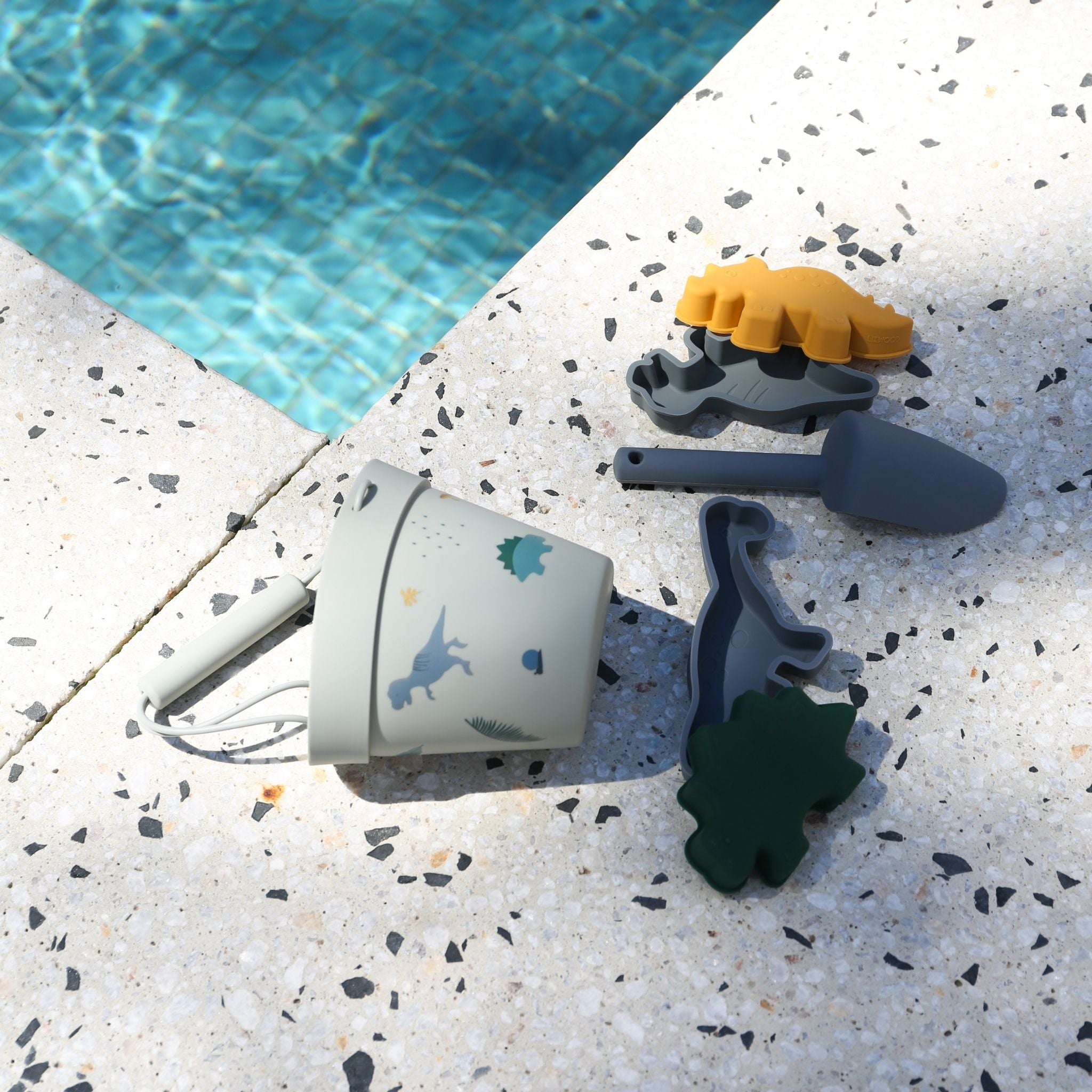 LIEWOOD Dante Beach Set - Dino Dove Blue Multi Mix | Kids Sand Toys for Outdoor Play, Pool Party & Summer Vacation Fun