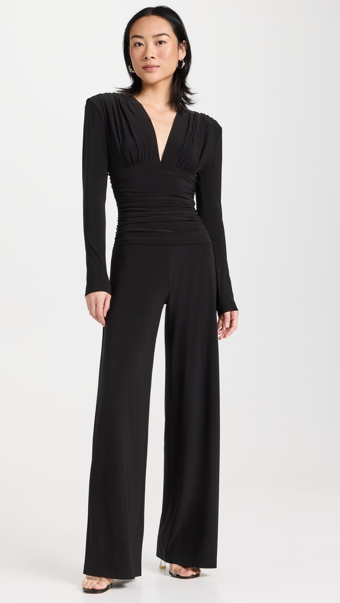 Norma Kamali Women's V-Neck Long Sleeve Shirred Waist Jumpsuit with Shoulder Pads | Elegant One-Piece Outfit for Work, Parties & Special Occasions