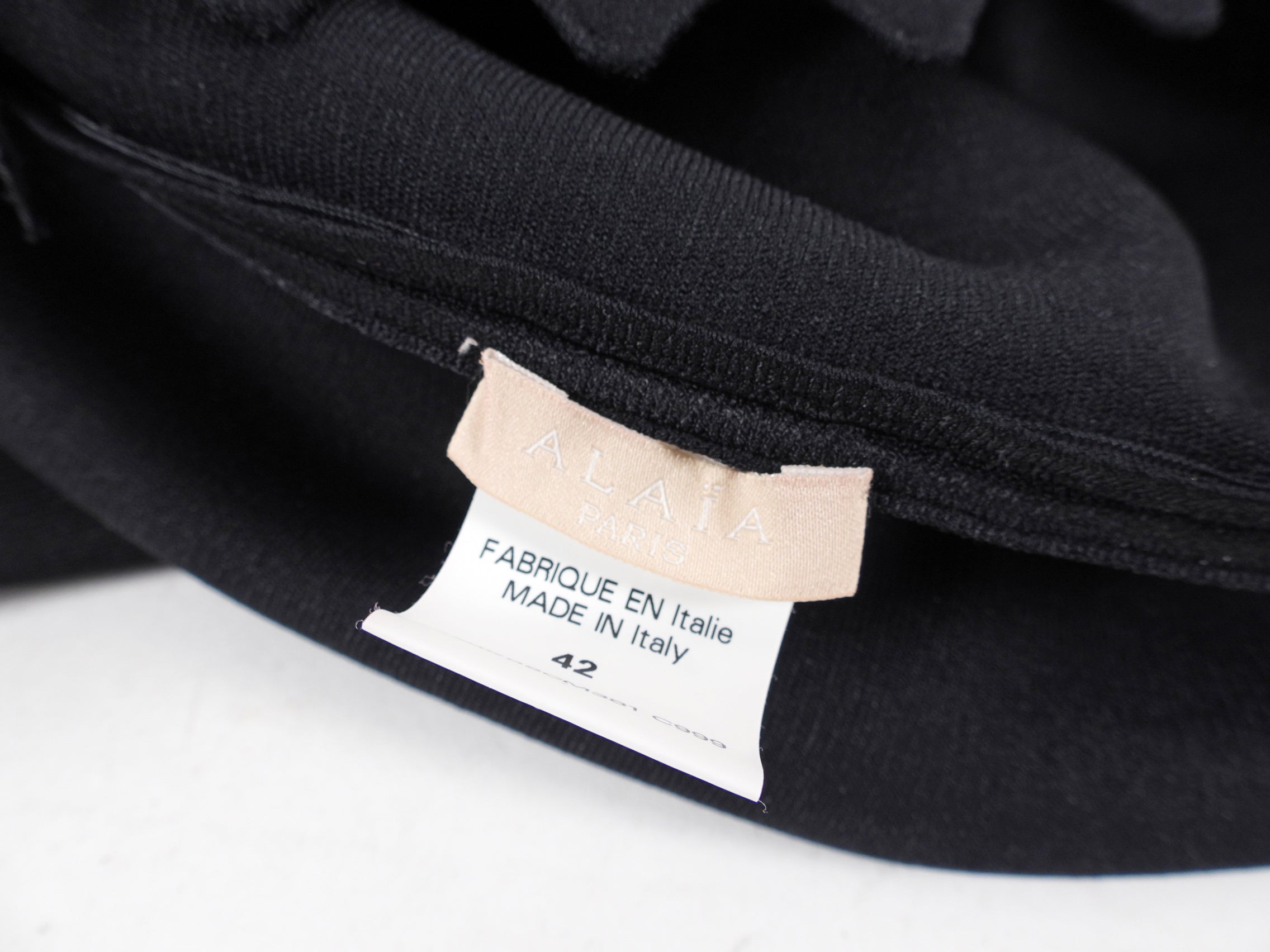 Alaia Black Knit Jersey Short Sleeve Dress with Perforated Hem - Size FR42 / US8 - Perfect for Cocktail Parties and Summer Evenings