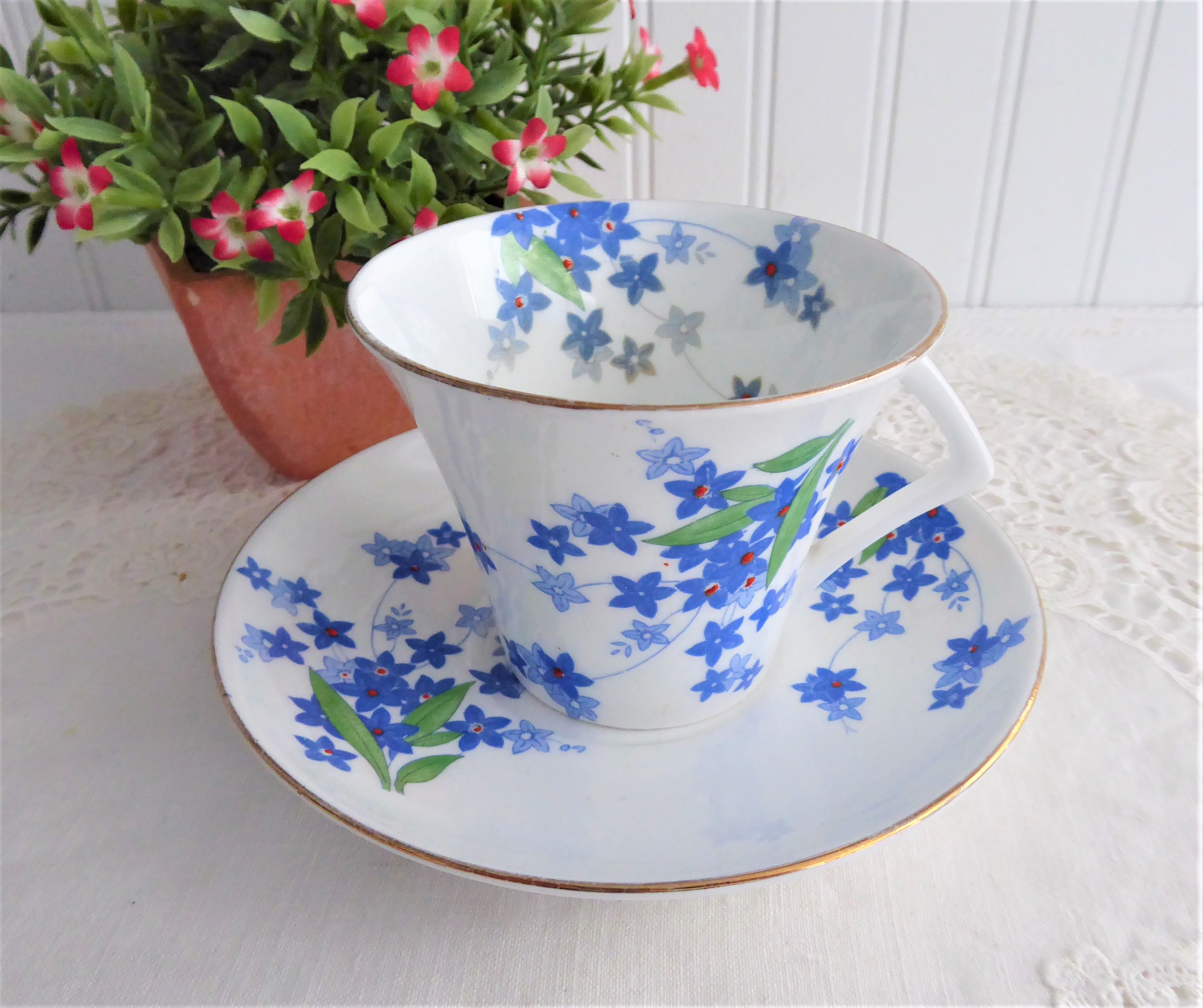 Vintage 1930s Art Deco Cup and Saucer Set - Blue Forget-Me-Not Floral Design with Red Enamel Accents - Perfect for Tea Parties, Antique Collecting, and Home Décor