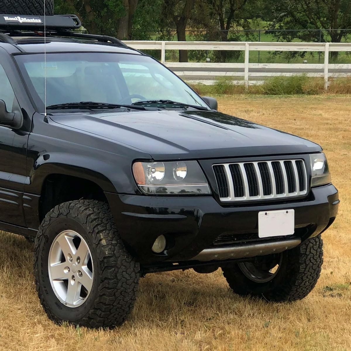 Jeep Grand Cherokee Headlights (1999-2004) - Black Replacement Headlamp Assembly Pair (Left + Right) for Improved Night Visibility & Off-Road Driving