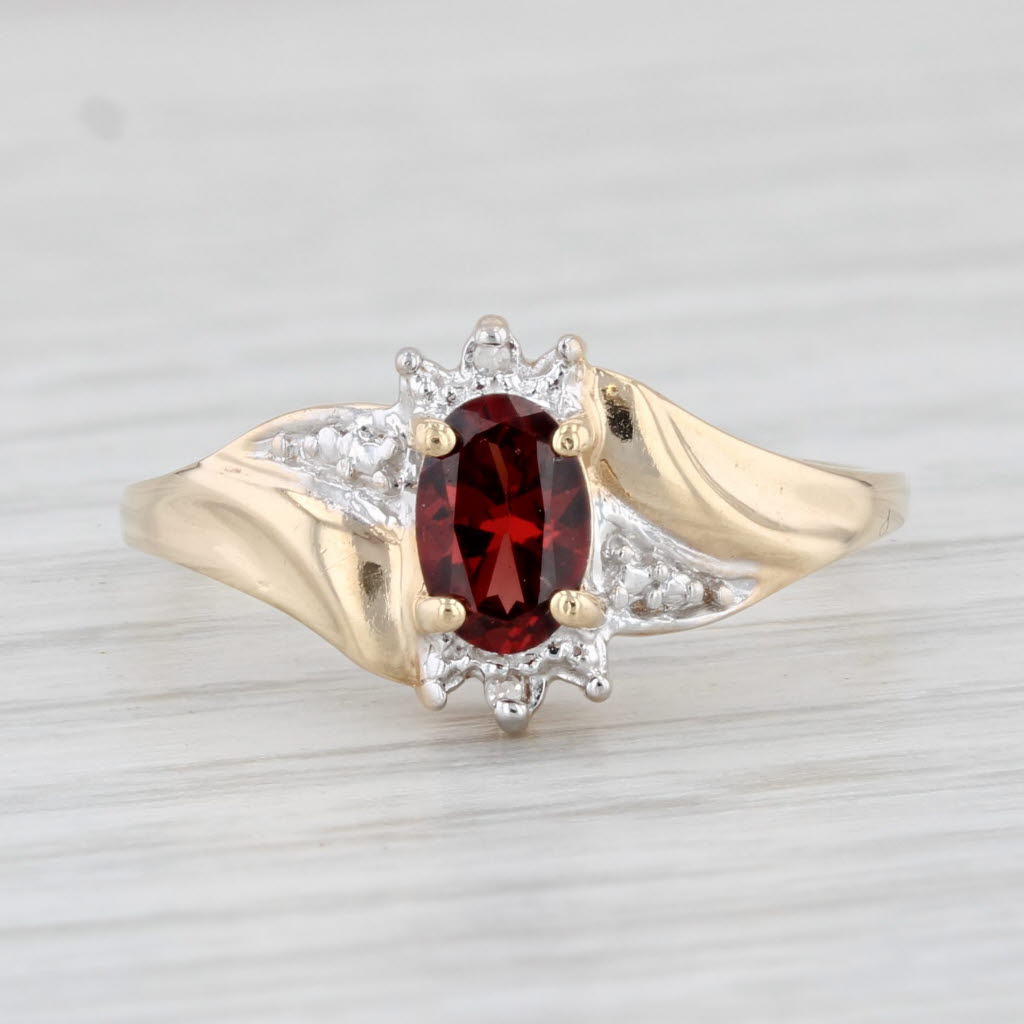0.58ctw Oval Garnet & Diamond Ring in 10k Yellow Gold, Size 6.75 - Elegant Bypass Design for Engagement, Anniversary & Special Occasions