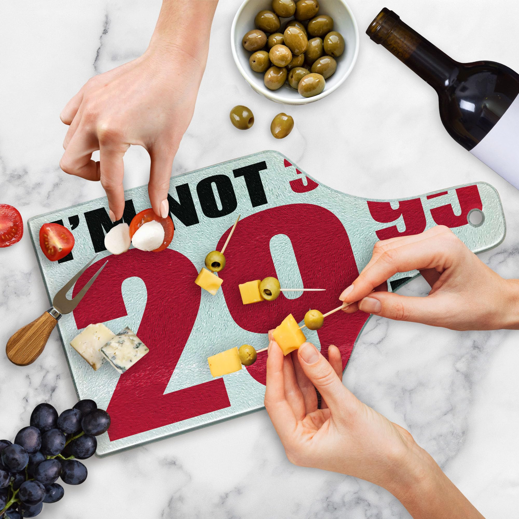 Ambesonne 30th Birthday Cutting Board - Funny 'Forever Young' Pictogram Design, Tempered Glass Serving Board in Wine Bottle Shape (Red, Black & White) - Perfect for Birthday Parties, Kitchen Decor & Gift Giving